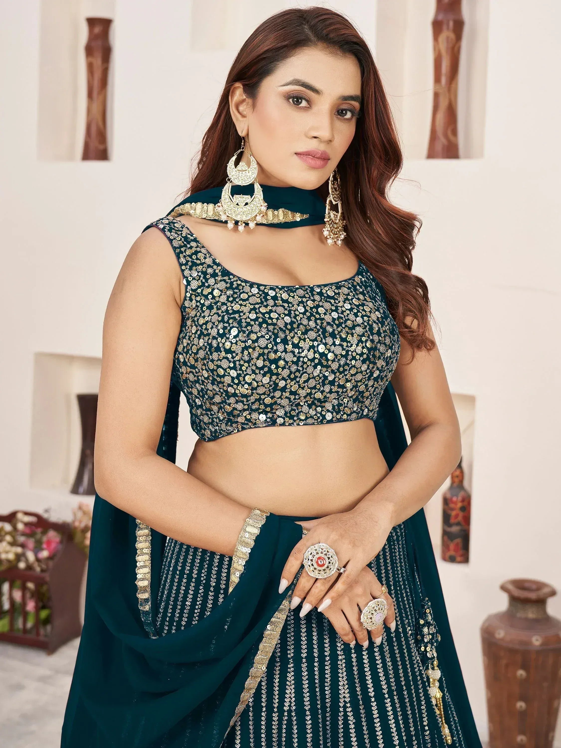 Teal designer lehenga choli with gold sequin work, perfect for Indian ethnic wear and festive occasions.