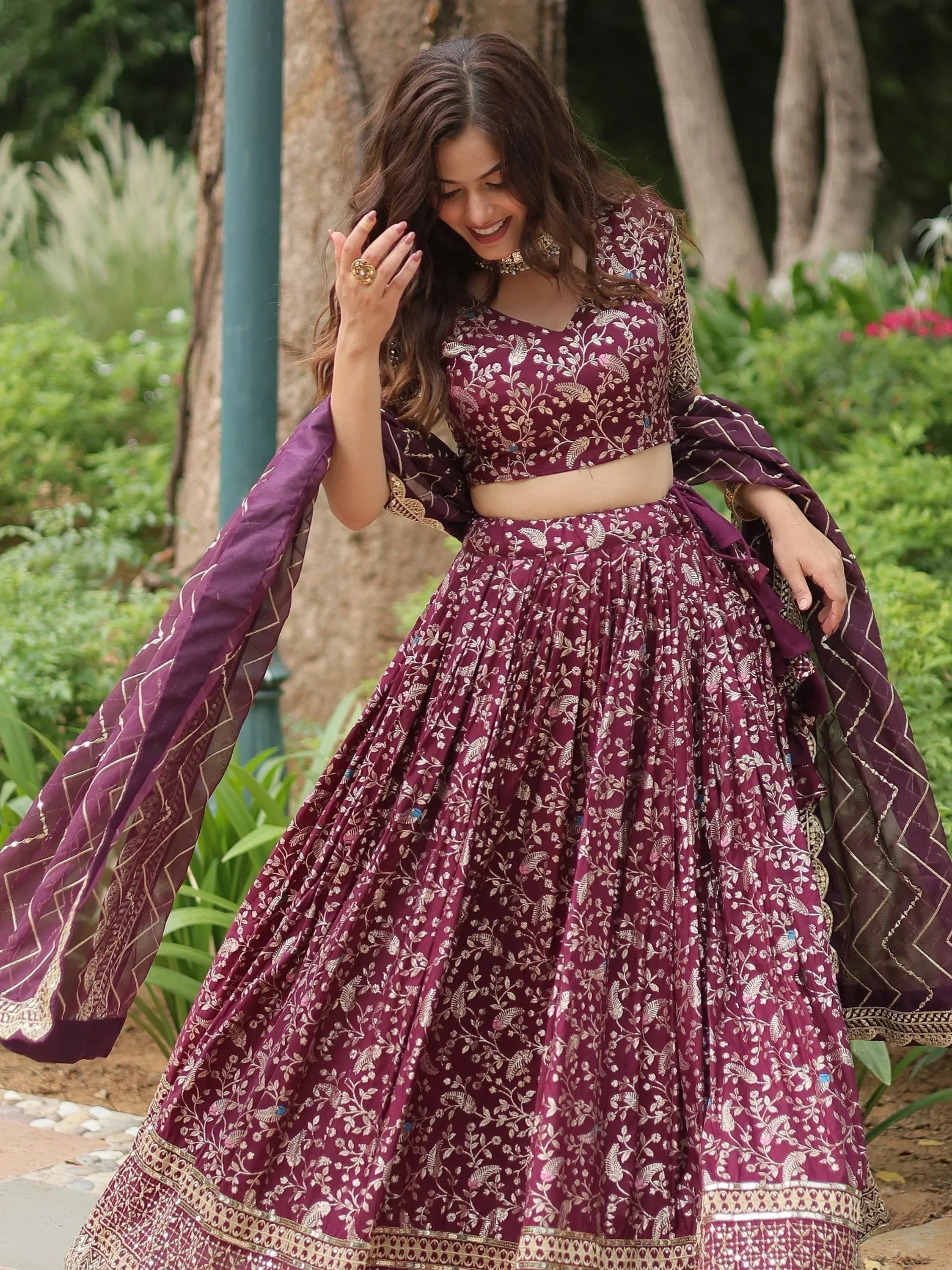 Elegant maroon lehenga choli with gold floral embroidery, perfect for Indian ethnic occasions