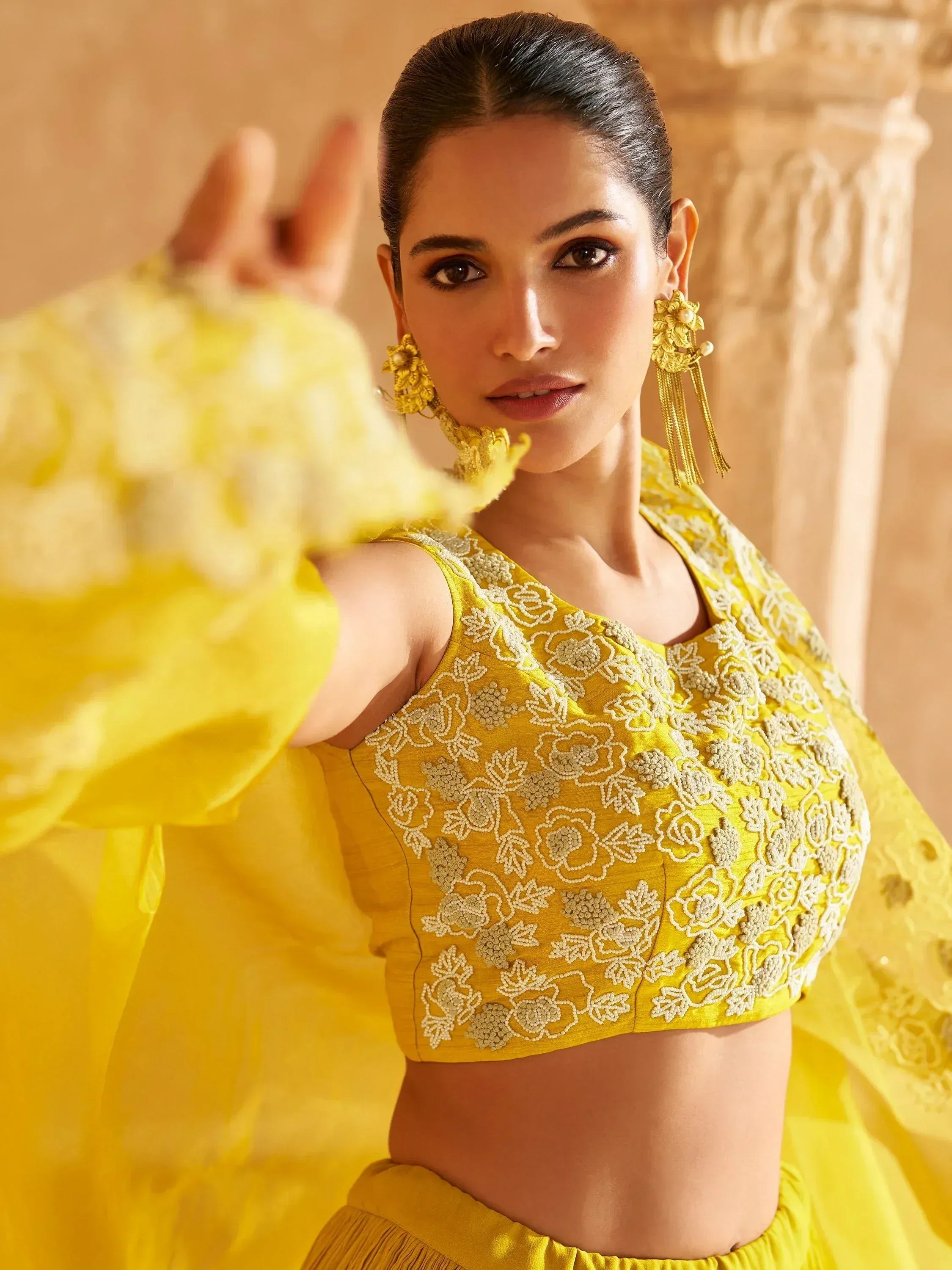 Yellow embroidered lehenga choli with floral beadwork, perfect for Indian ethnic wear events