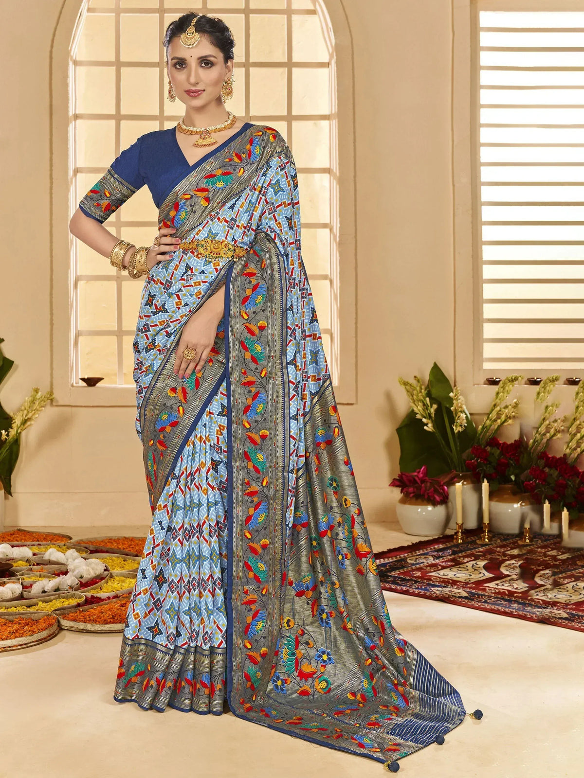 Blue floral printed saree with gold border, paired with designer blouse, perfect for Indian ethnic occasions