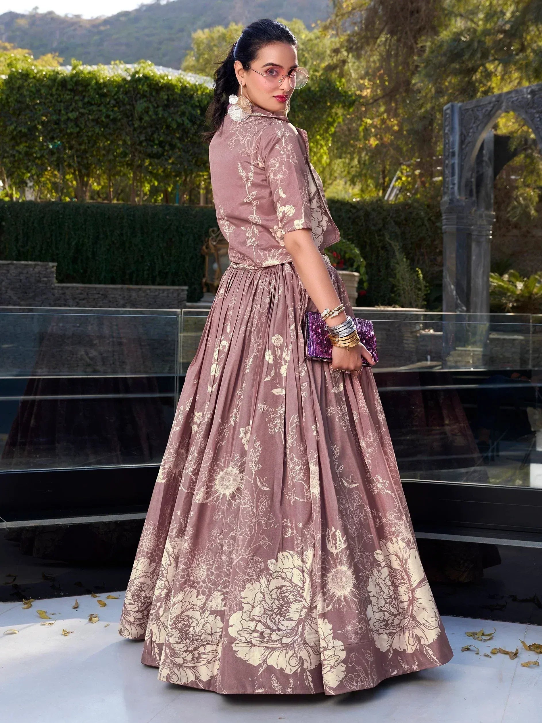 Elegant mauve floral print lehenga choli with gold detailing, perfect for Indian ethnic occasions.