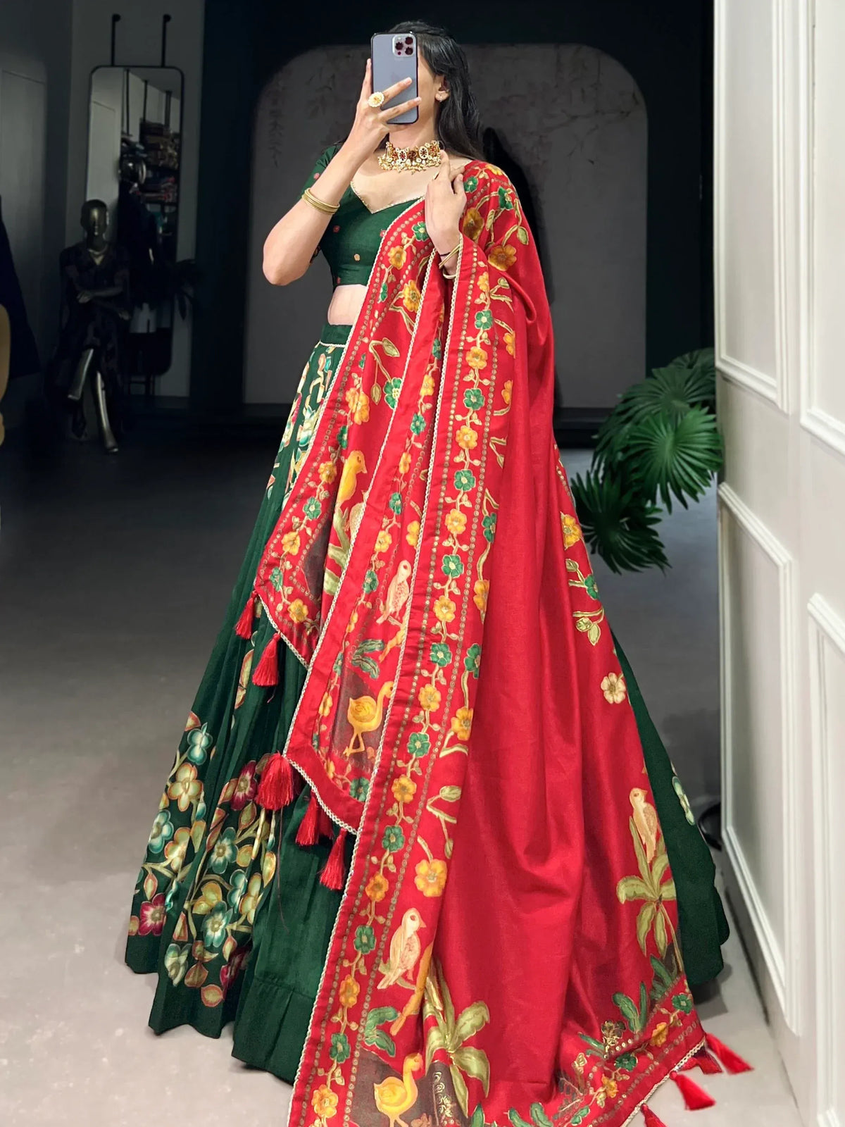 Green lehenga choli with red floral dupatta, embroidered birds and tassels, Indian ethnic wear