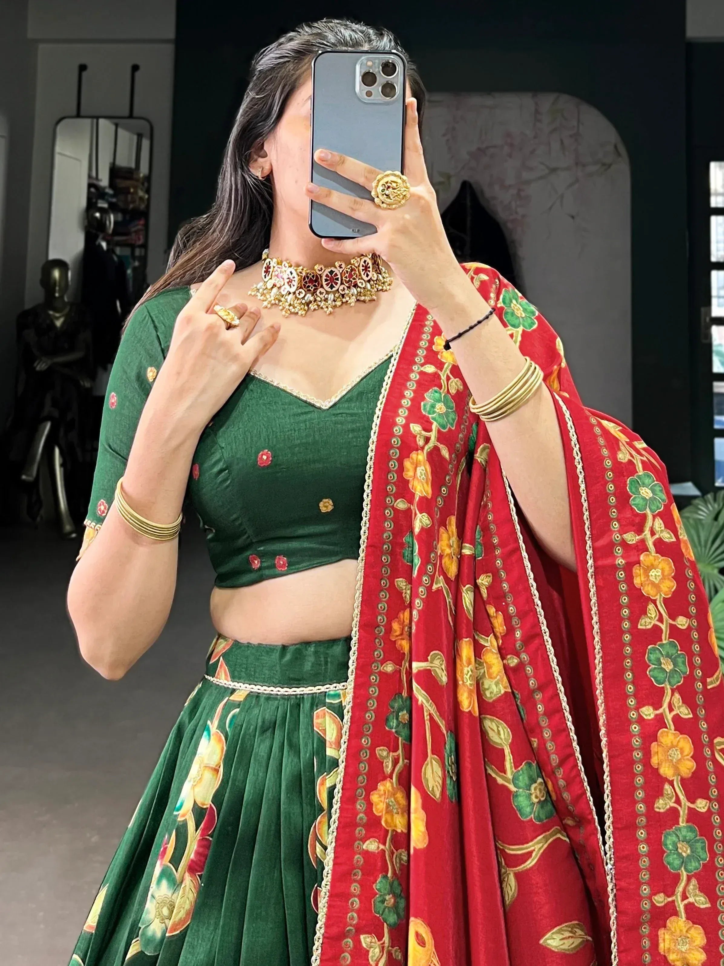 Green floral lehenga choli with red dupatta, traditional Indian ethnic wear, perfect for weddings and festivals.