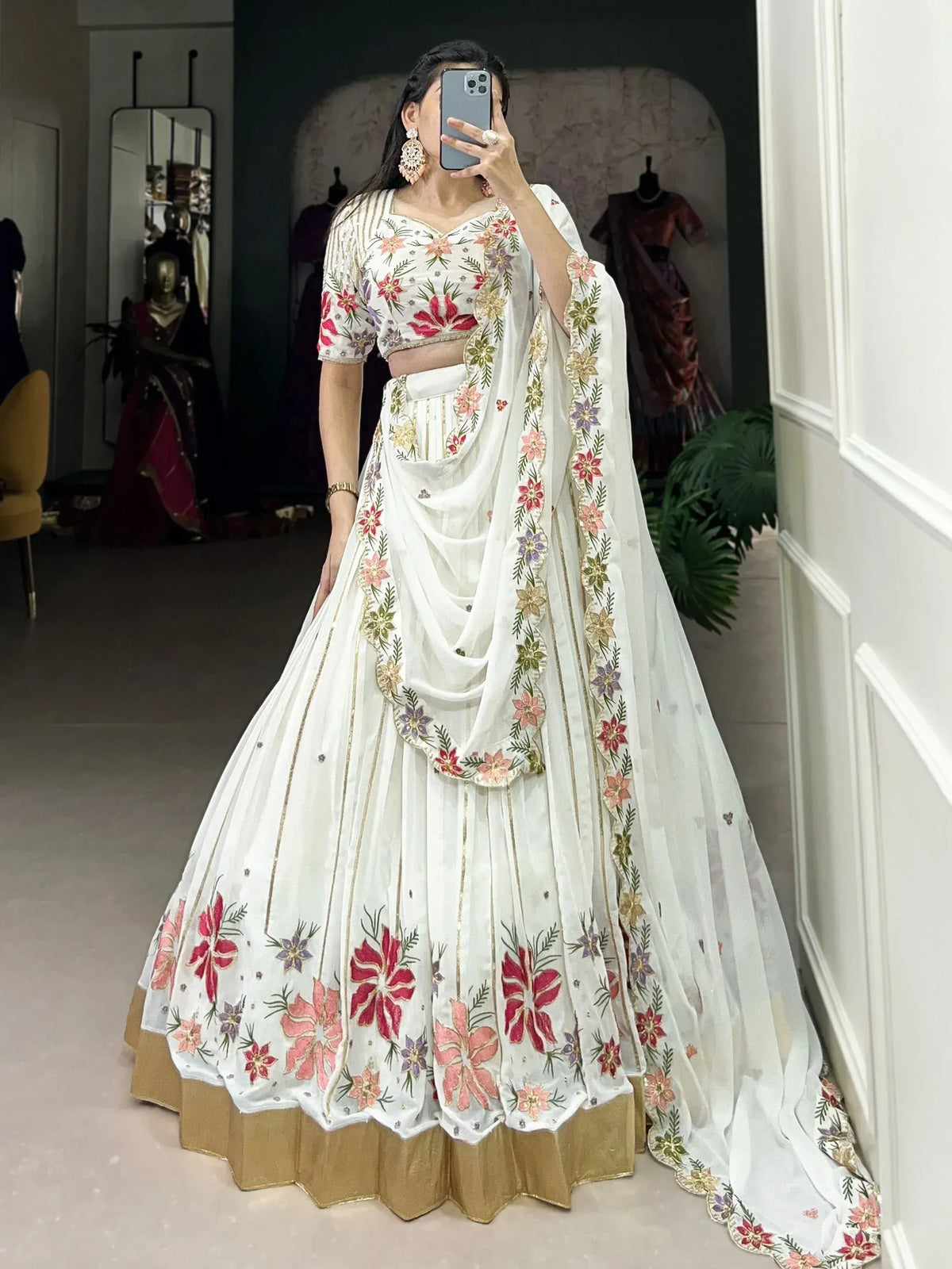 White floral embroidered lehenga choli with gold trim, perfect for Indian ethnic wear occasions