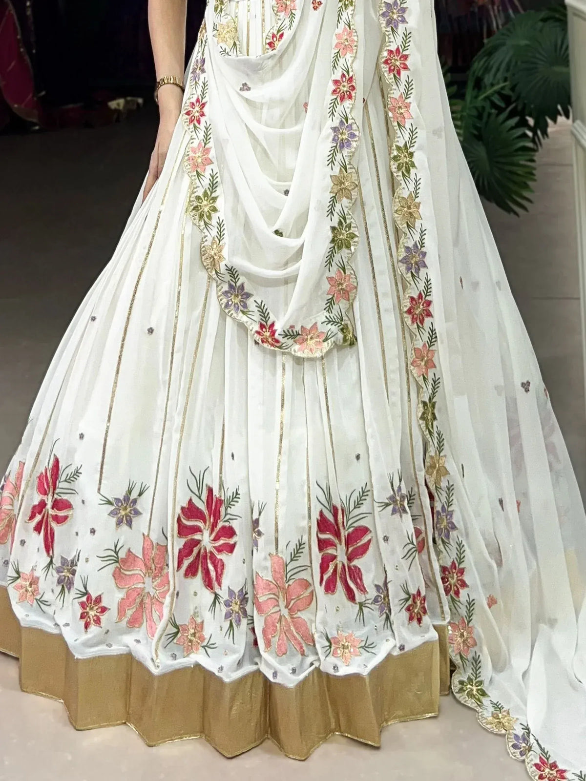 White floral embroidered lehenga choli with gold trim and dupatta, Indian ethnic wear