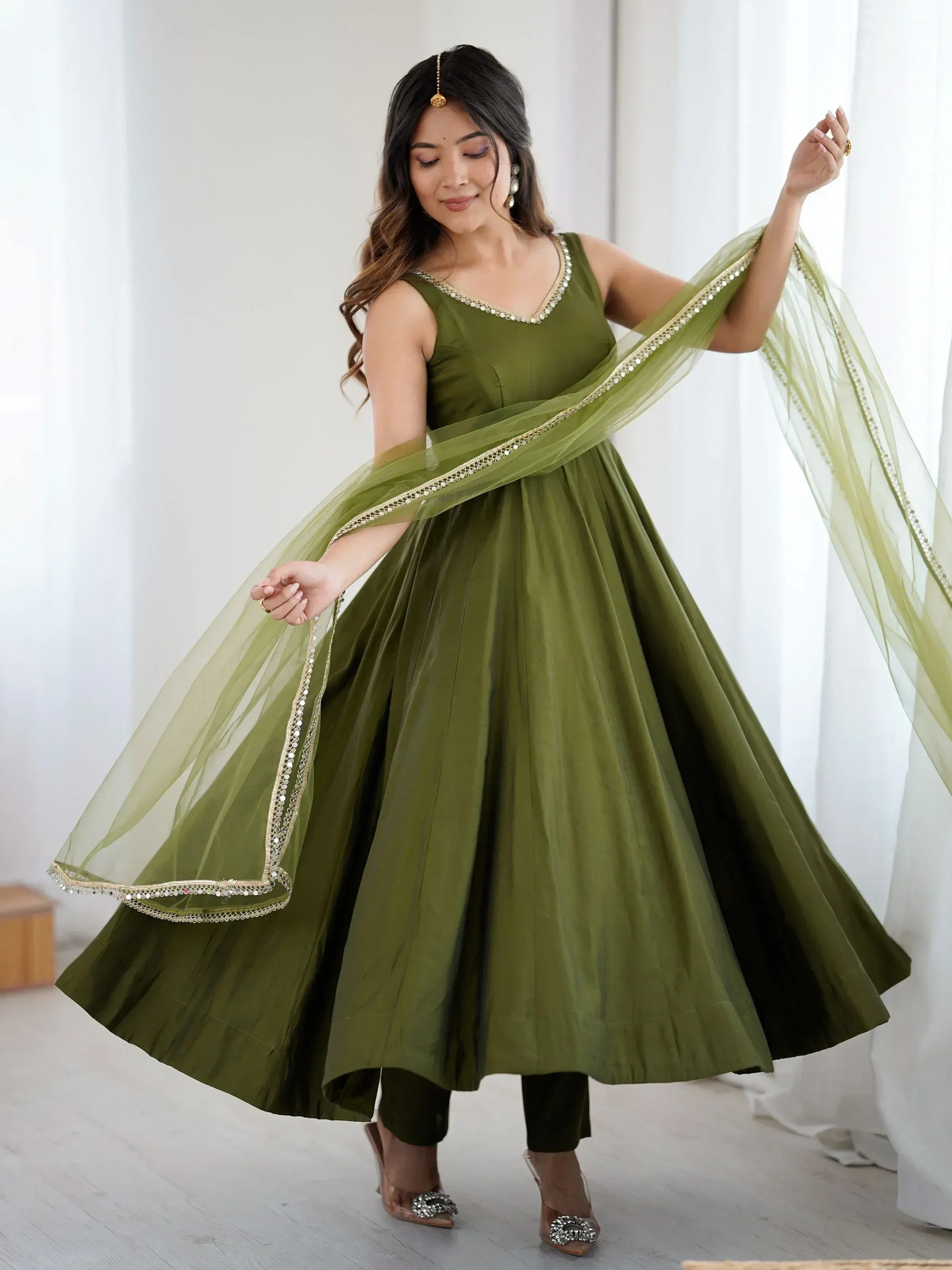 Olive green ethnic anarkali gown with gold embellished dupatta, perfect for Indian weddings and festive occasions