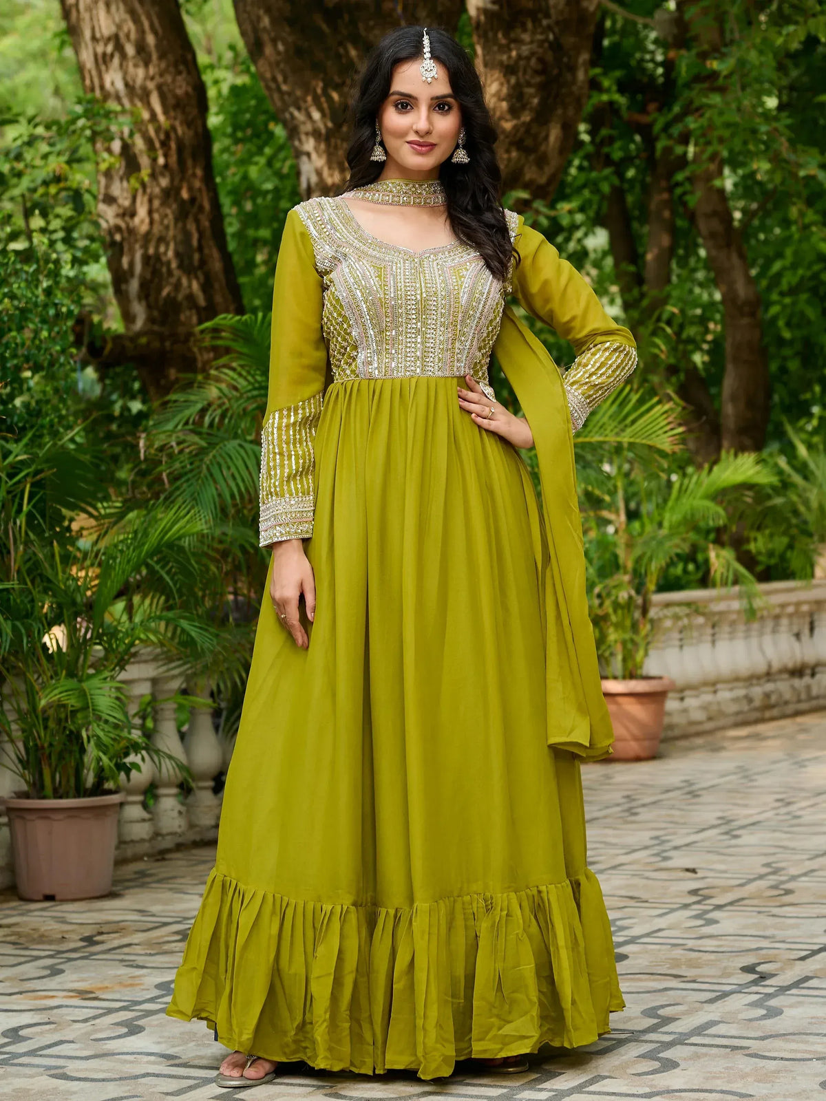 Olive green embroidered anarkali gown with ruffled hem, perfect for Indian ethnic occasions
