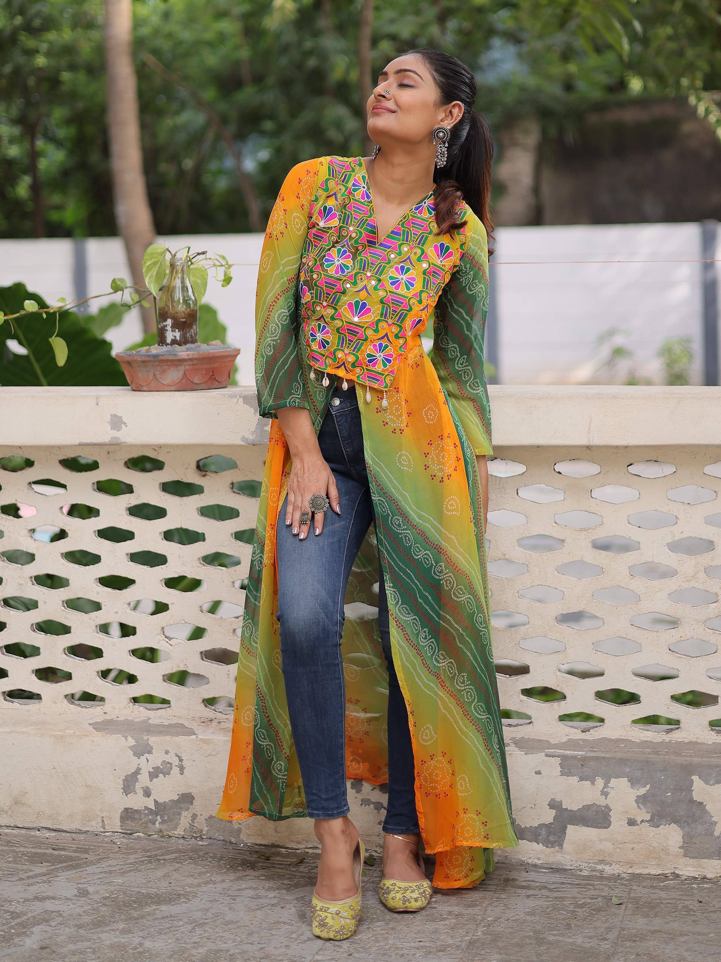 Woman in vibrant yellow-green embroidered ethnic kurta with jeans, perfect for Indian festive wear