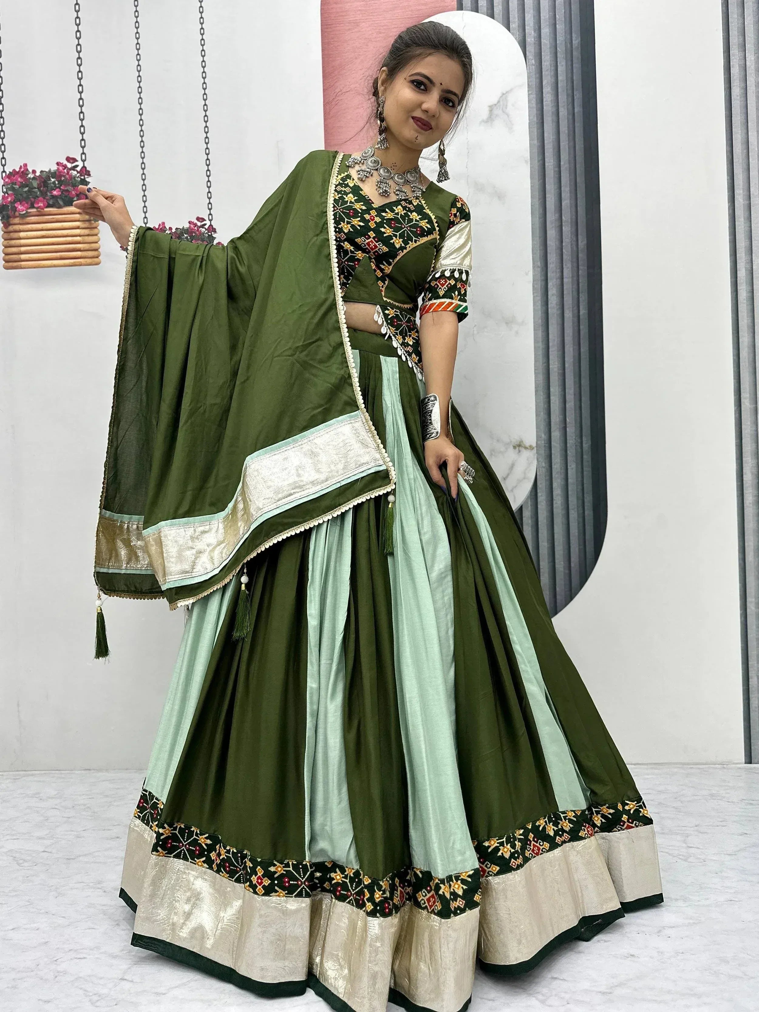 Green and mint designer lehenga choli with embroidered blouse and dupatta, perfect for Indian ethnic occasions.