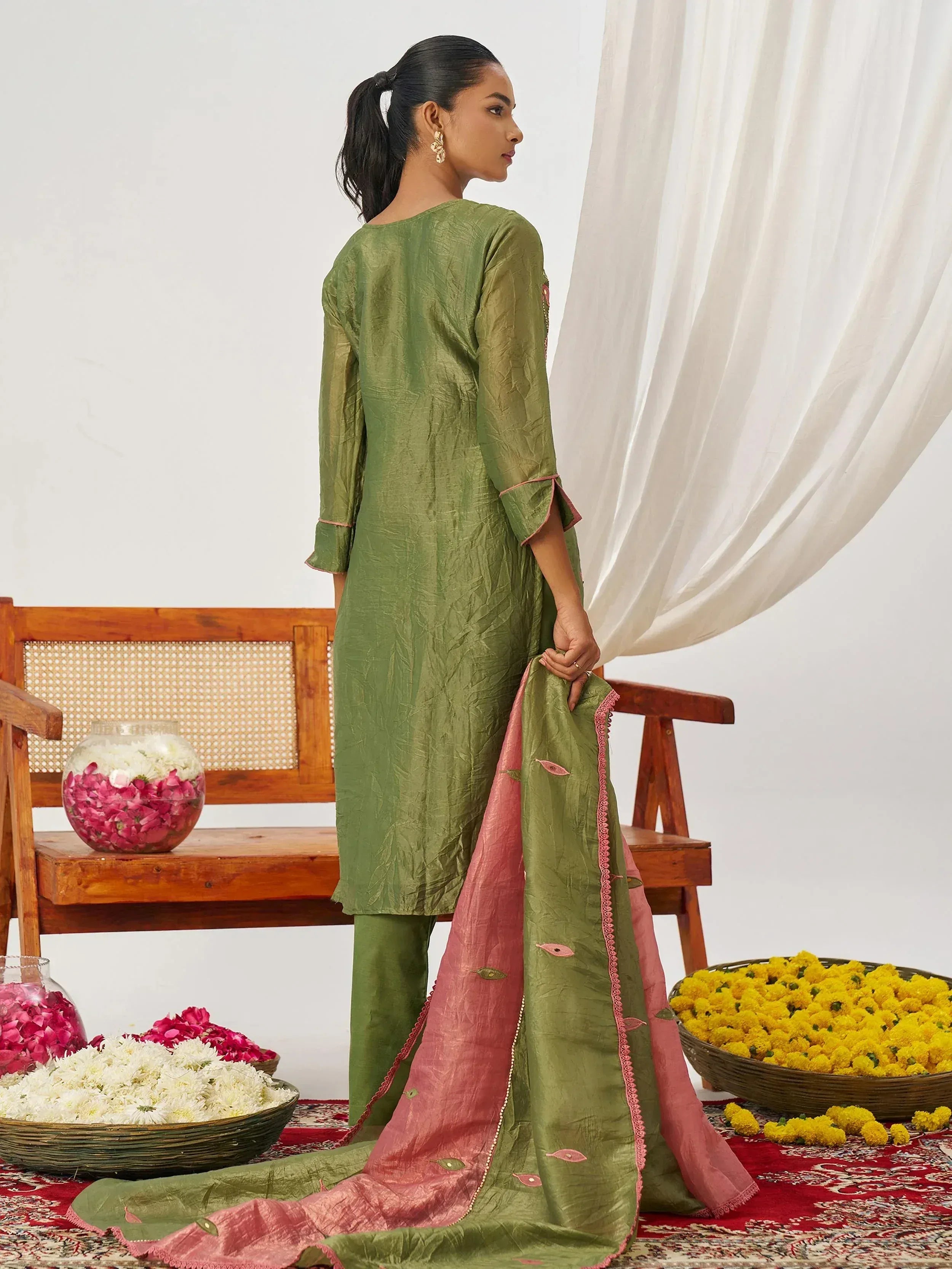 Olive green ethnic salwar kameez with pink dupatta, floral embroidery, and matching palazzo pants for women.