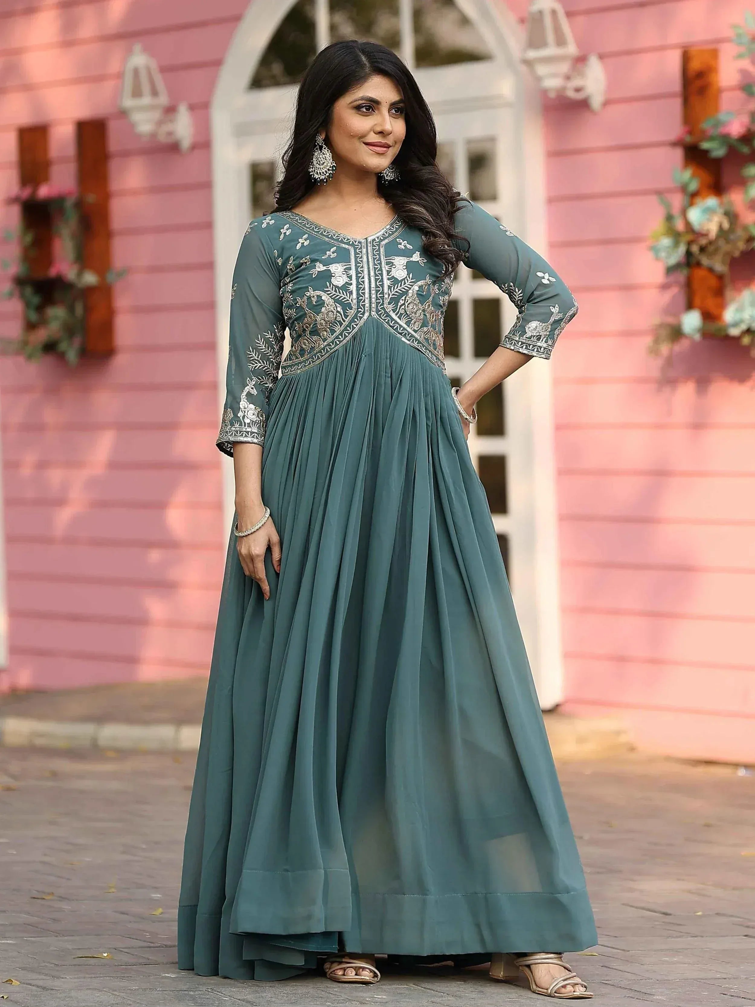 Teal embroidered ethnic gown with peacock motifs, perfect for Indian occasions and festive wear.