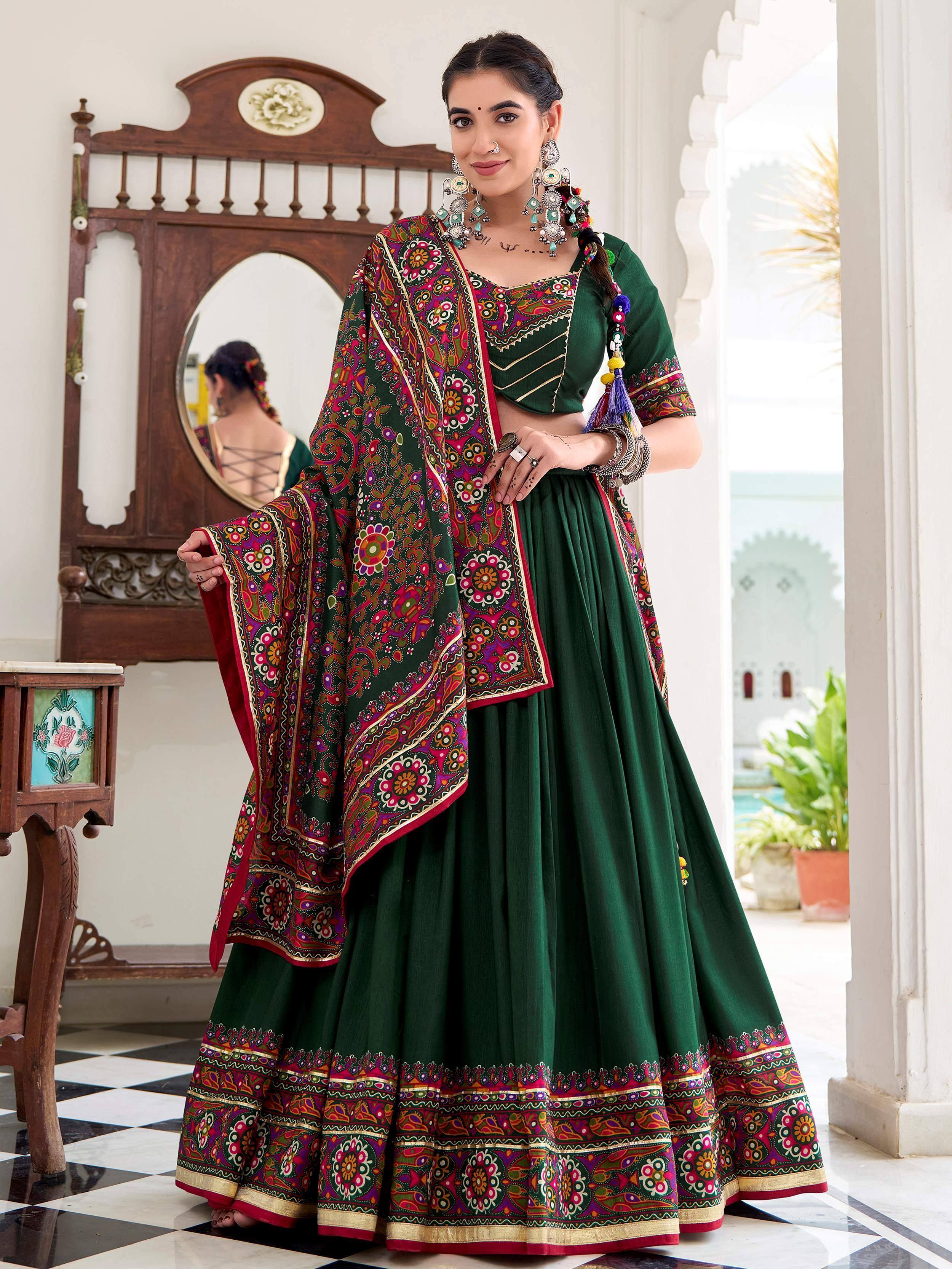 Green embroidered lehenga choli with colorful floral dupatta, traditional Indian ethnic wear