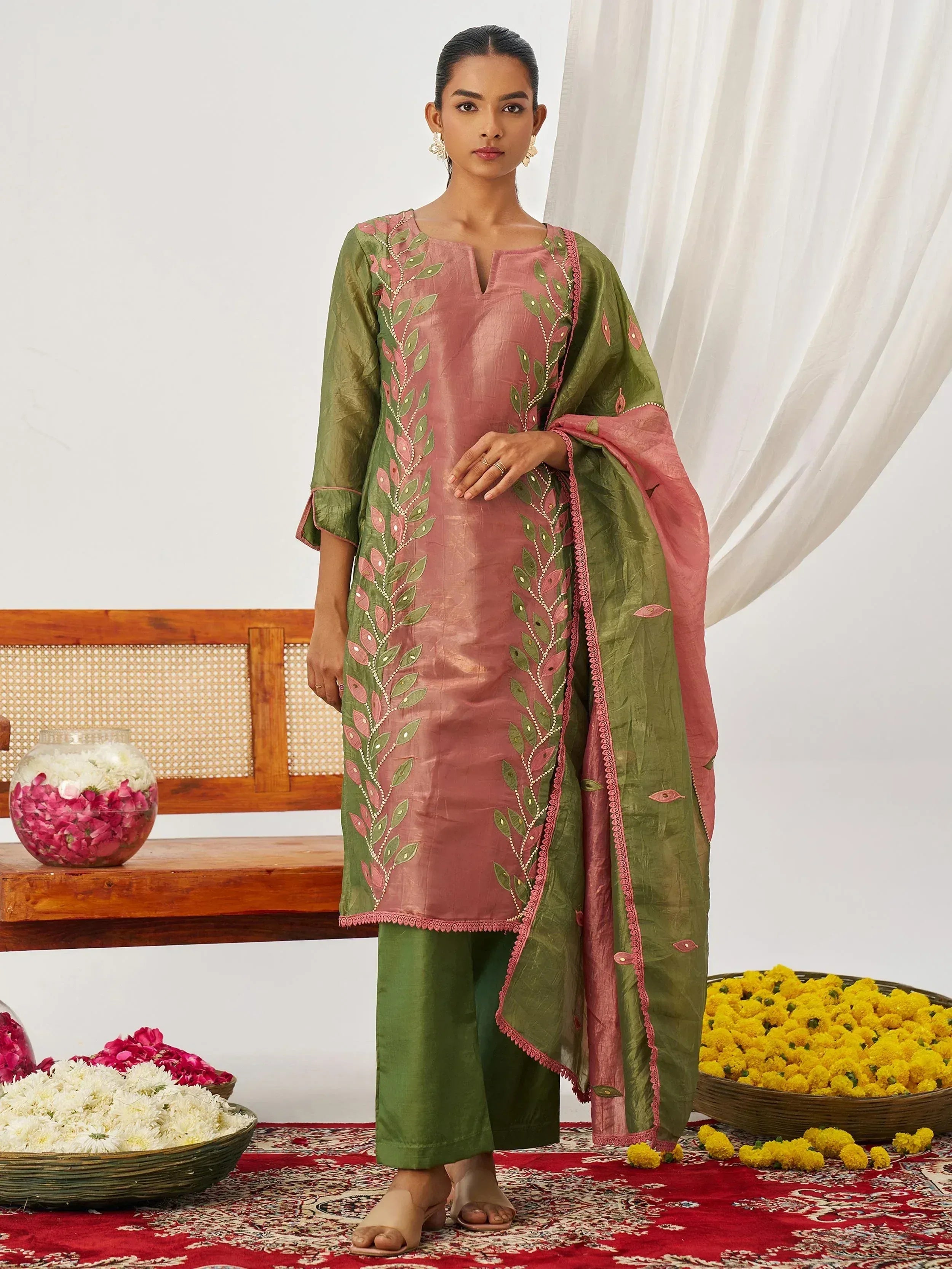 Pink and green embroidered salwar kameez with leaf motifs, perfect for Indian ethnic wear occasions