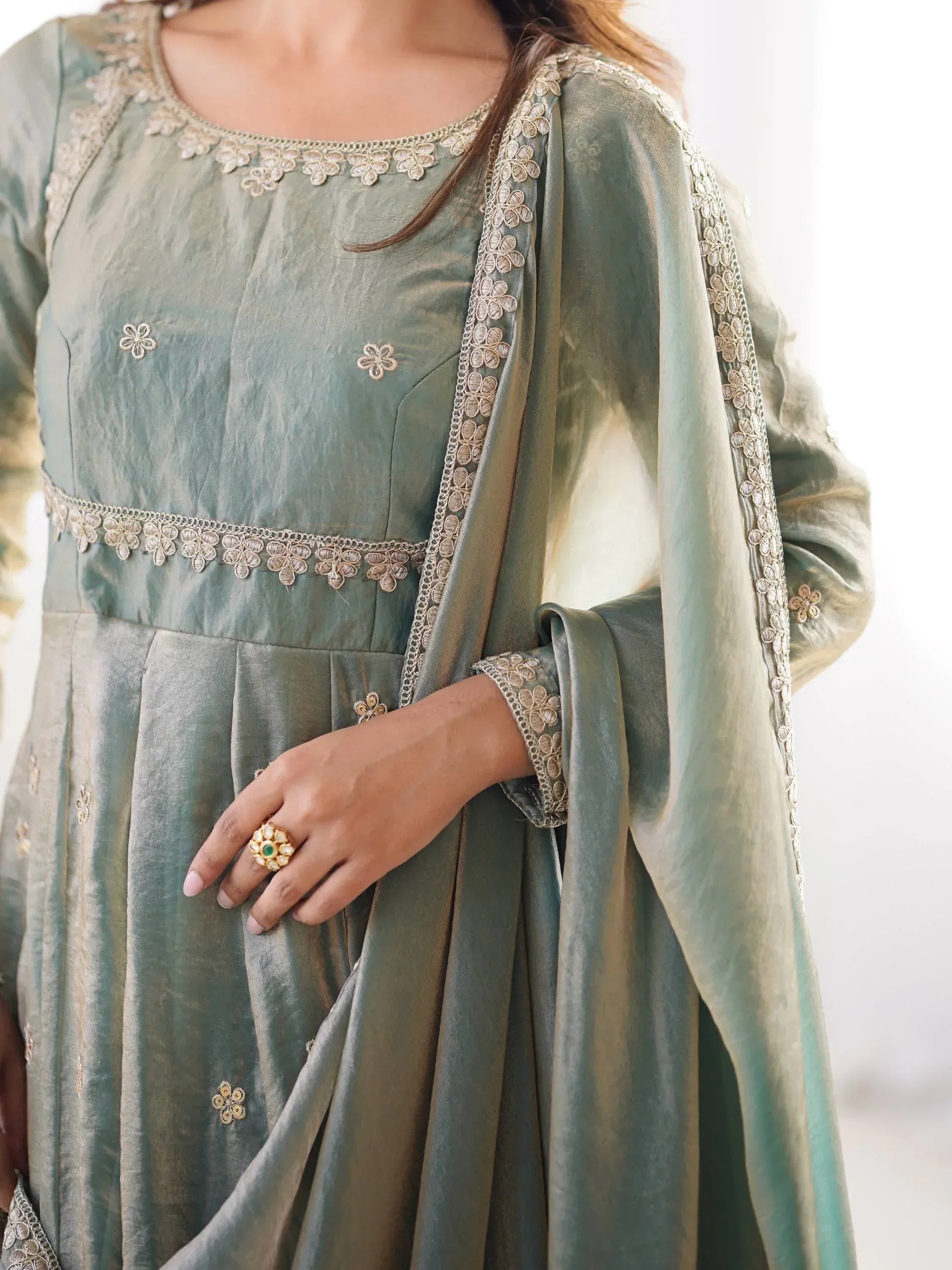 Elegant green Indian ethnic gown with gold floral embroidery and matching dupatta