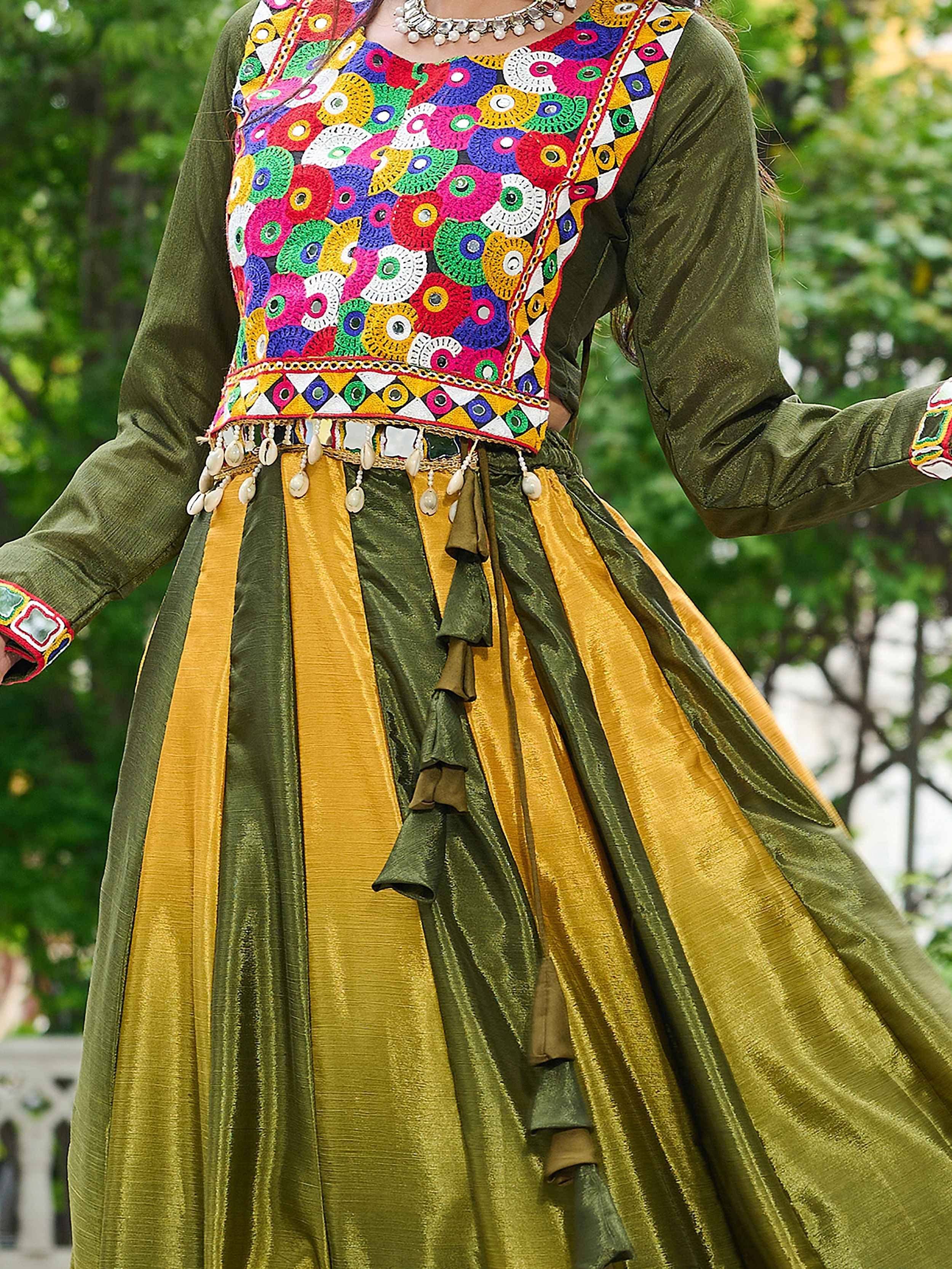 Colorful embroidered Indian ethnic wear with mirror work, olive and mustard velvet skirt, traditional jewelry