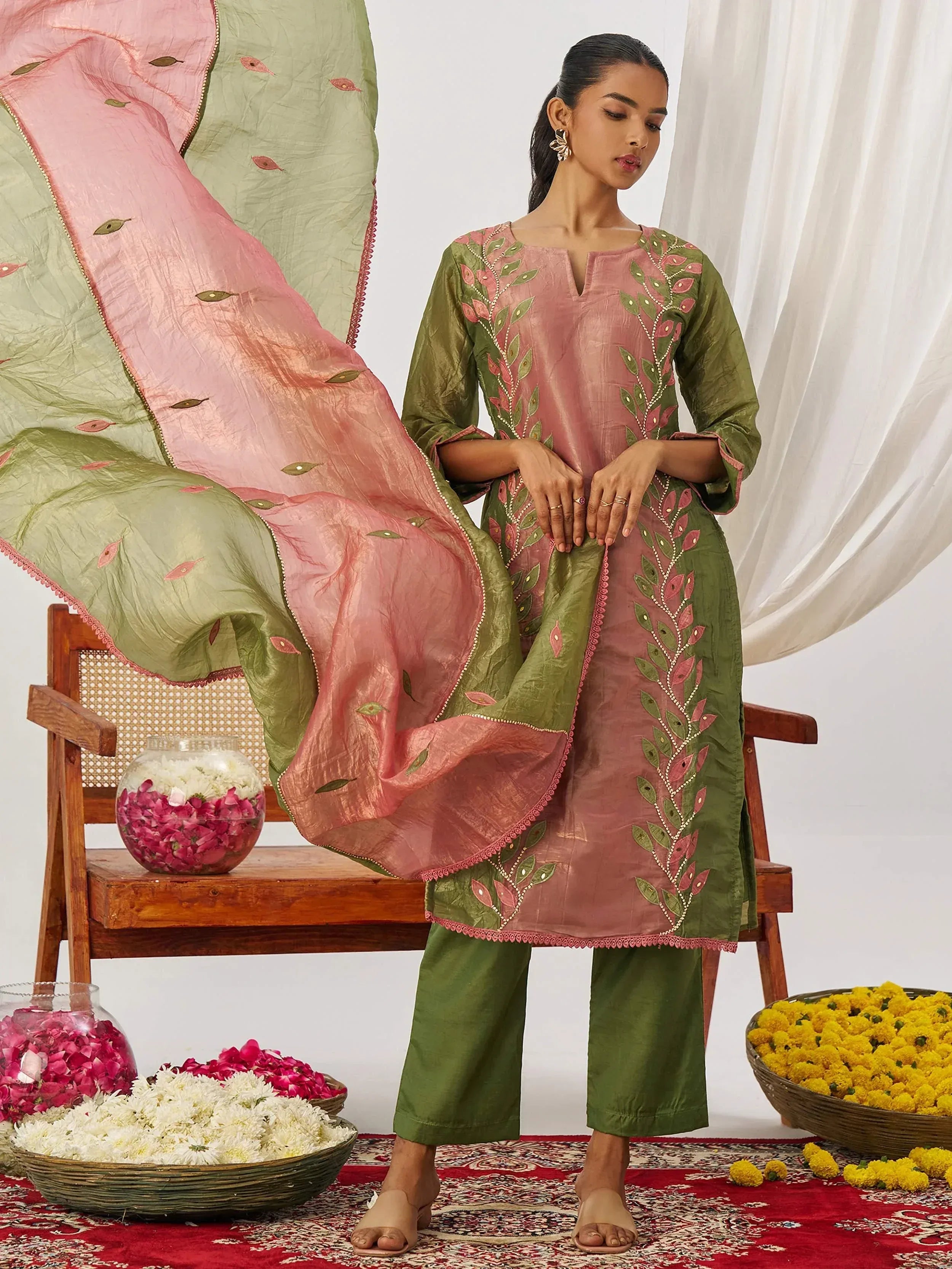 Pink and green embroidered salwar kameez with floral dupatta, perfect for ethnic occasions