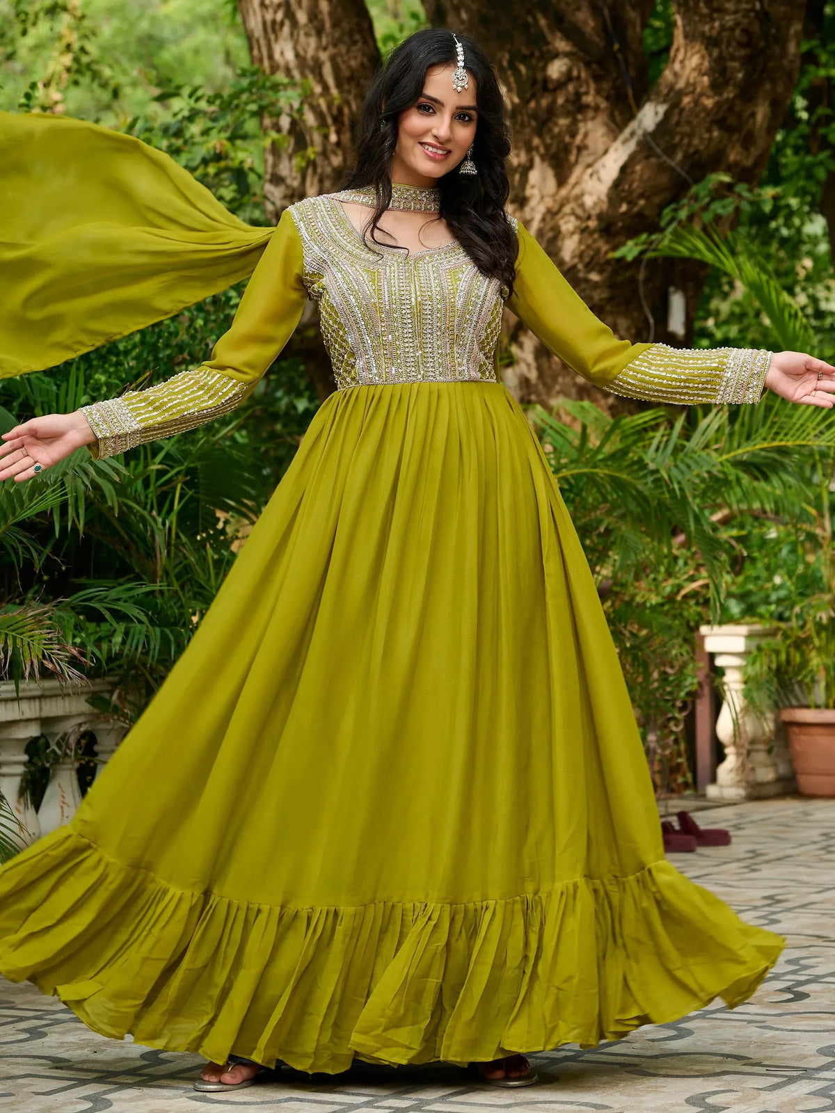 Olive green ethnic gown with silver embroidery, perfect for Indian festive occasions and weddings
