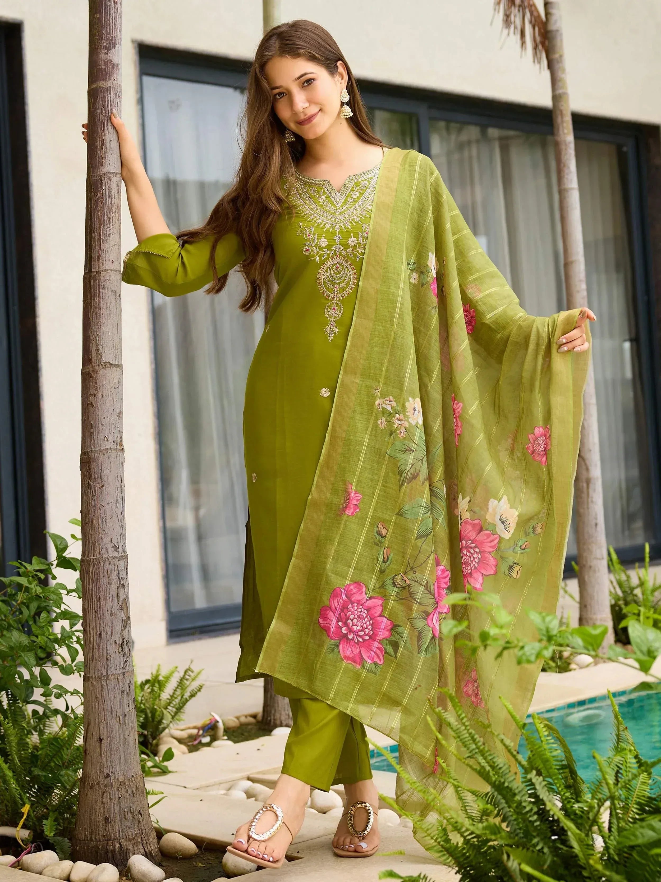 Green embroidered salwar kameez with floral dupatta, perfect for ethnic wear and festive occasions.