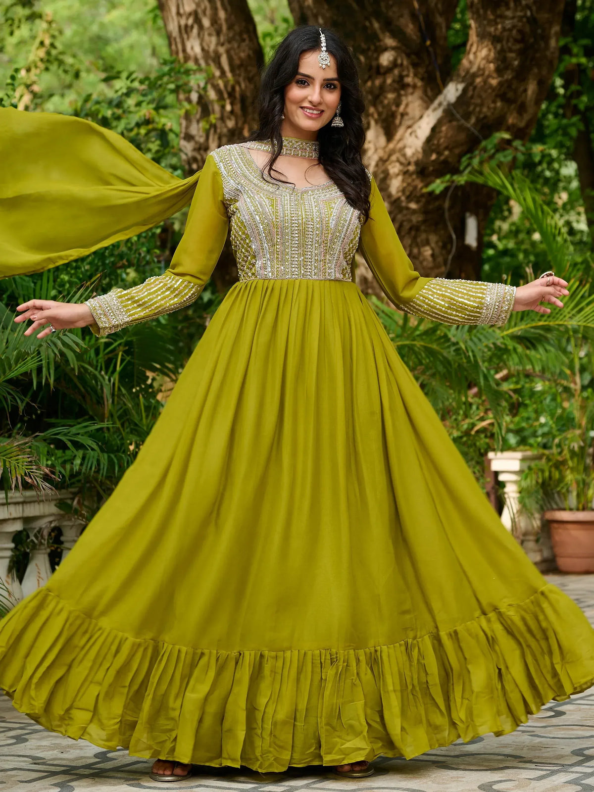Olive green embroidered anarkali gown with ruffled hem, perfect for Indian ethnic wear occasions.