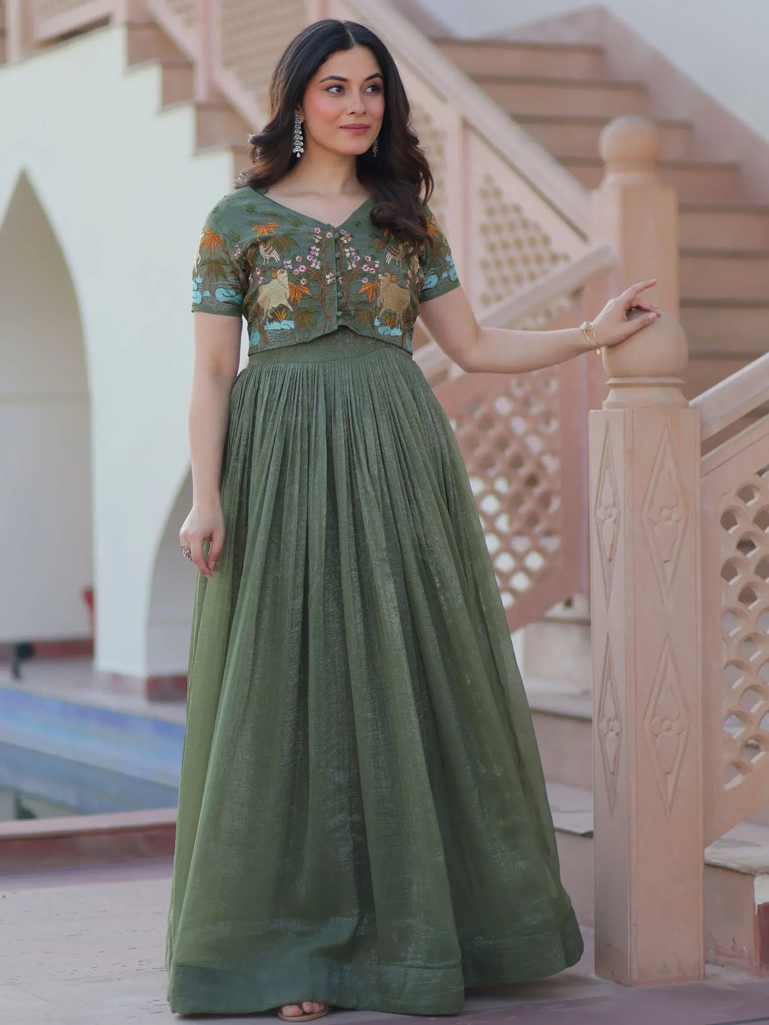Olive green ethnic gown with floral and animal embroidery, pleated skirt, perfect for Indian occasions
