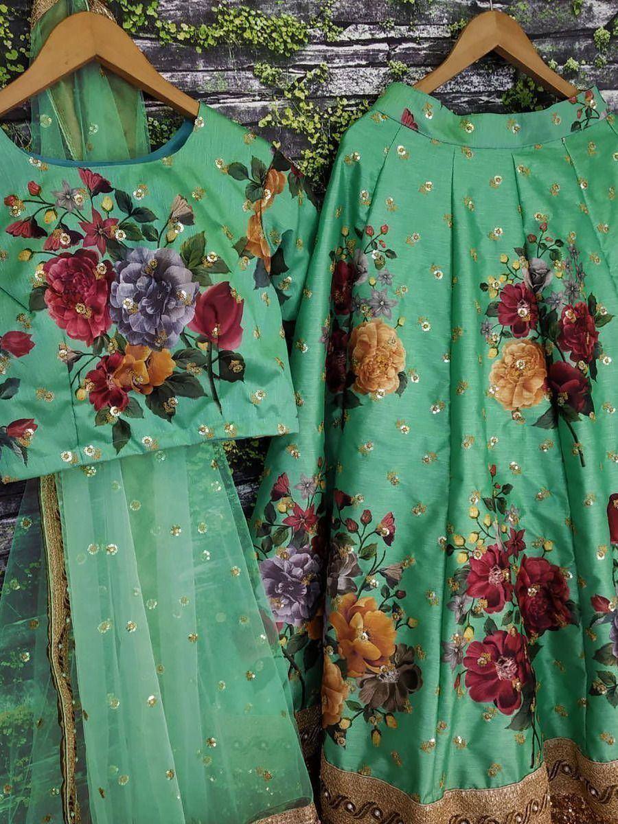 Green floral printed lehenga choli with gold embellishments, perfect for ethnic occasions