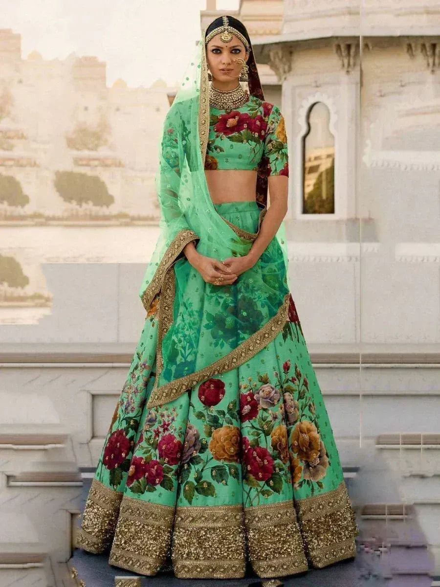 Mint green floral lehenga choli with gold embroidery, perfect for Indian weddings and festive occasions.