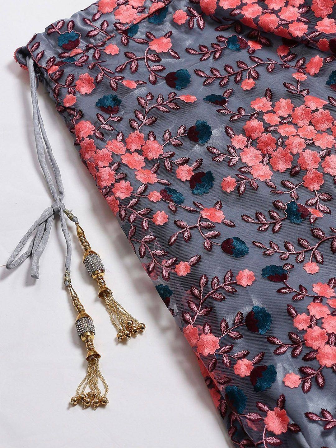 Grey floral embroidered ethnic gown with gold tassels, perfect for Indian wear occasions.
