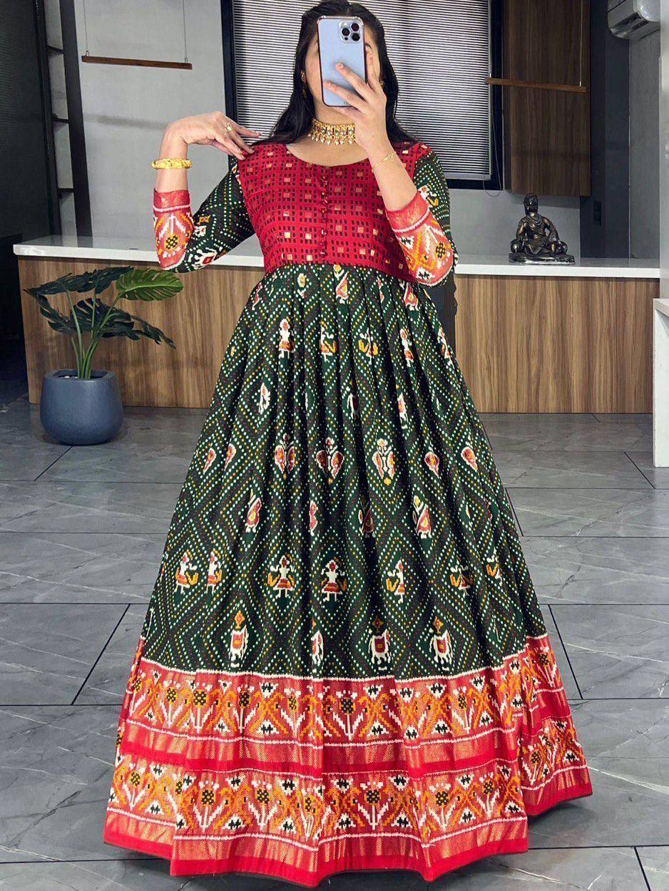 Green and red ethnic gown with intricate print, perfect for Indian festive occasions