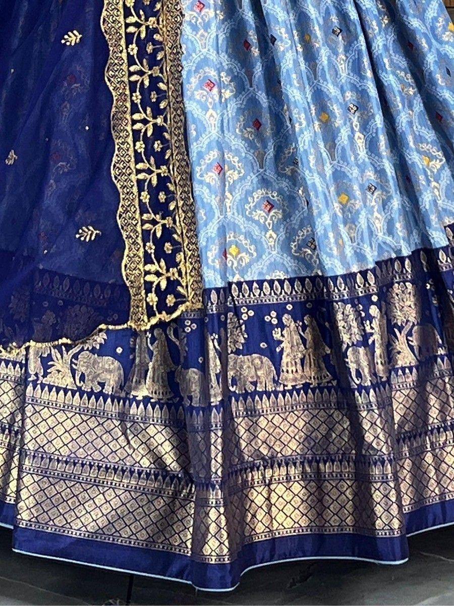 Blue and gold embroidered lehenga with elephant motifs and intricate border detailing