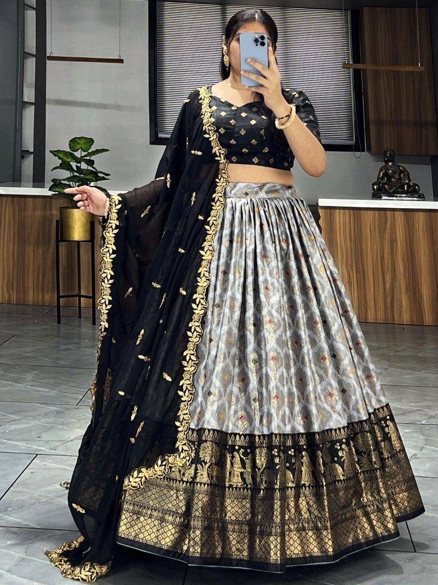 Black and silver lehenga choli with gold embroidery, perfect for Indian ethnic wear occasions