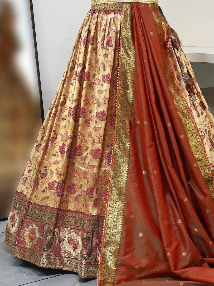 Designer lehenga choli with gold paisley print and red dupatta, ethnic Indian wear
