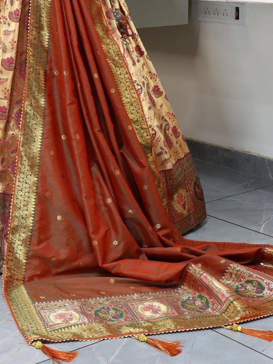 Red and gold embroidered lehenga choli with floral border and tassels, Indian ethnic wear