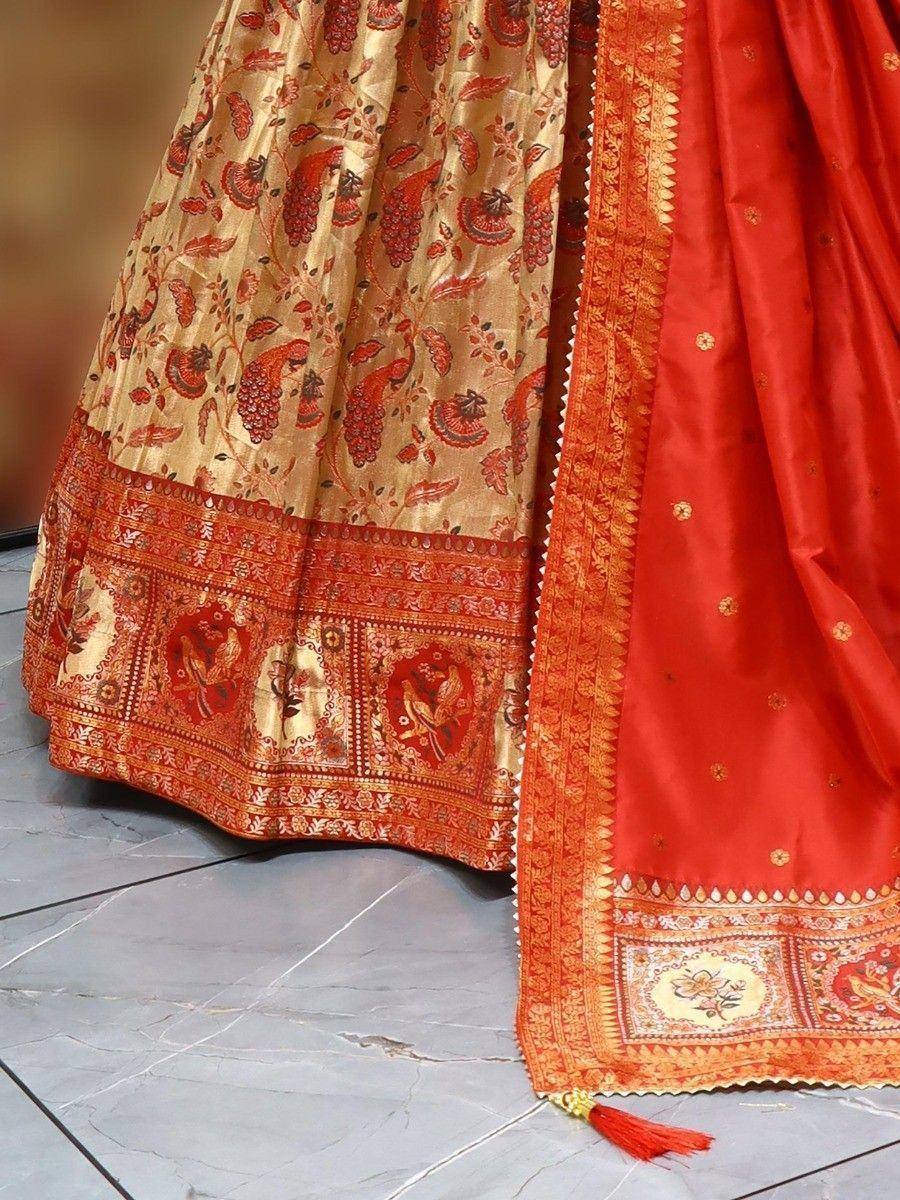 Red and gold designer lehenga choli with intricate paisley print and embroidered border