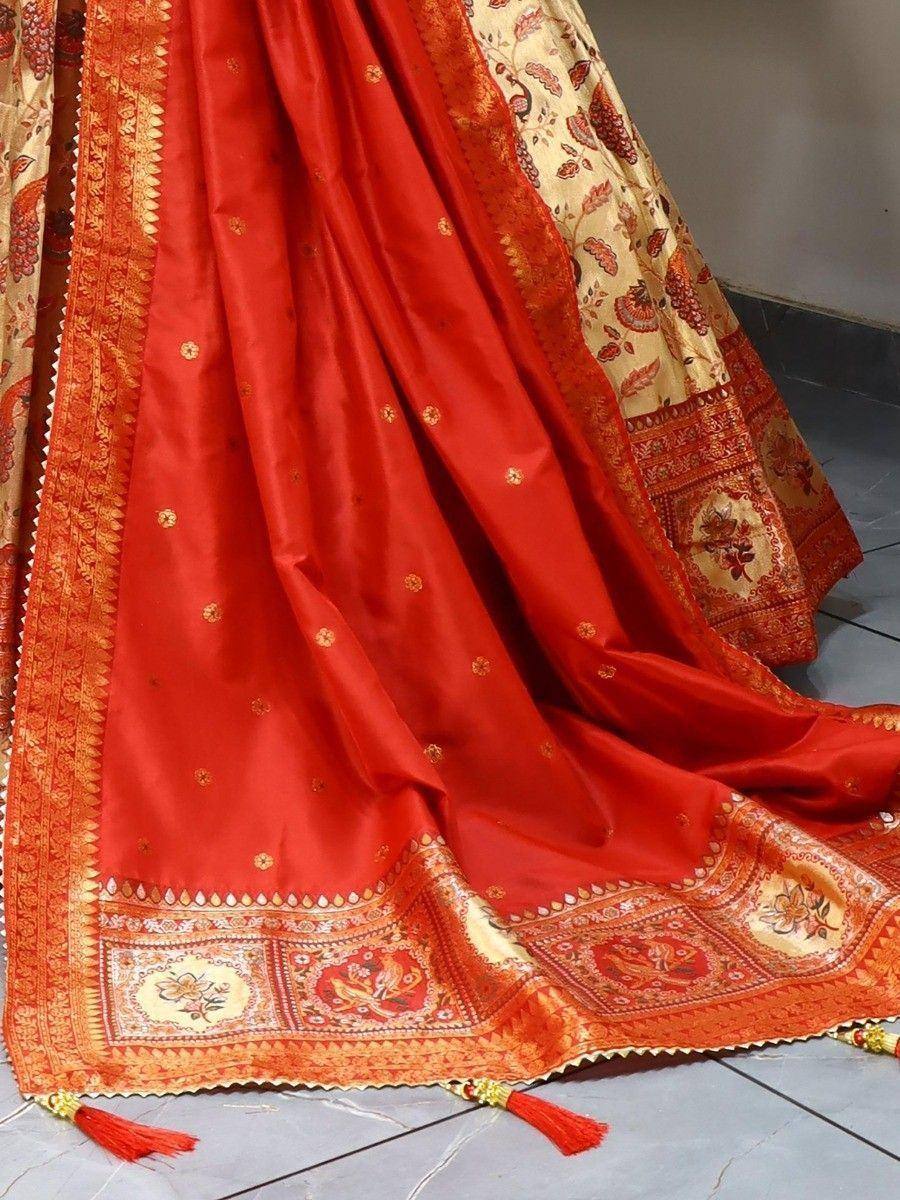 Red and gold embroidered lehenga choli with floral border and tassels, Indian ethnic wear