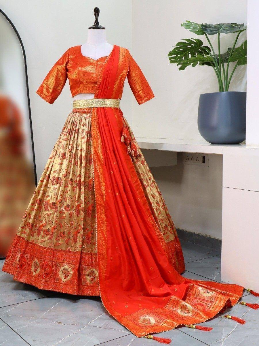 Orange and gold designer lehenga choli with floral print, perfect for Indian weddings and festivals