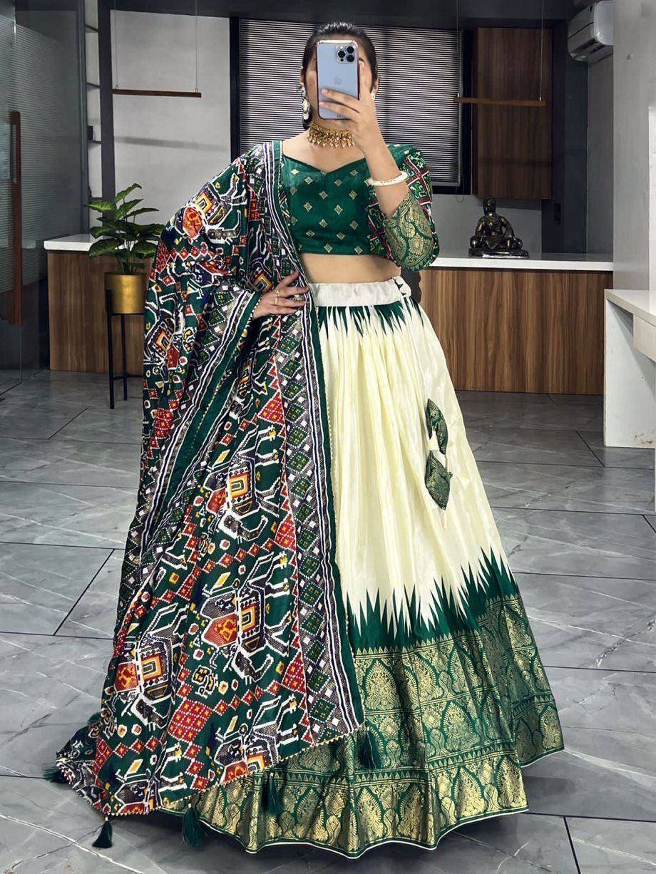 Green and cream printed lehenga choli with ethnic patterns, perfect for Indian weddings and festive occasions