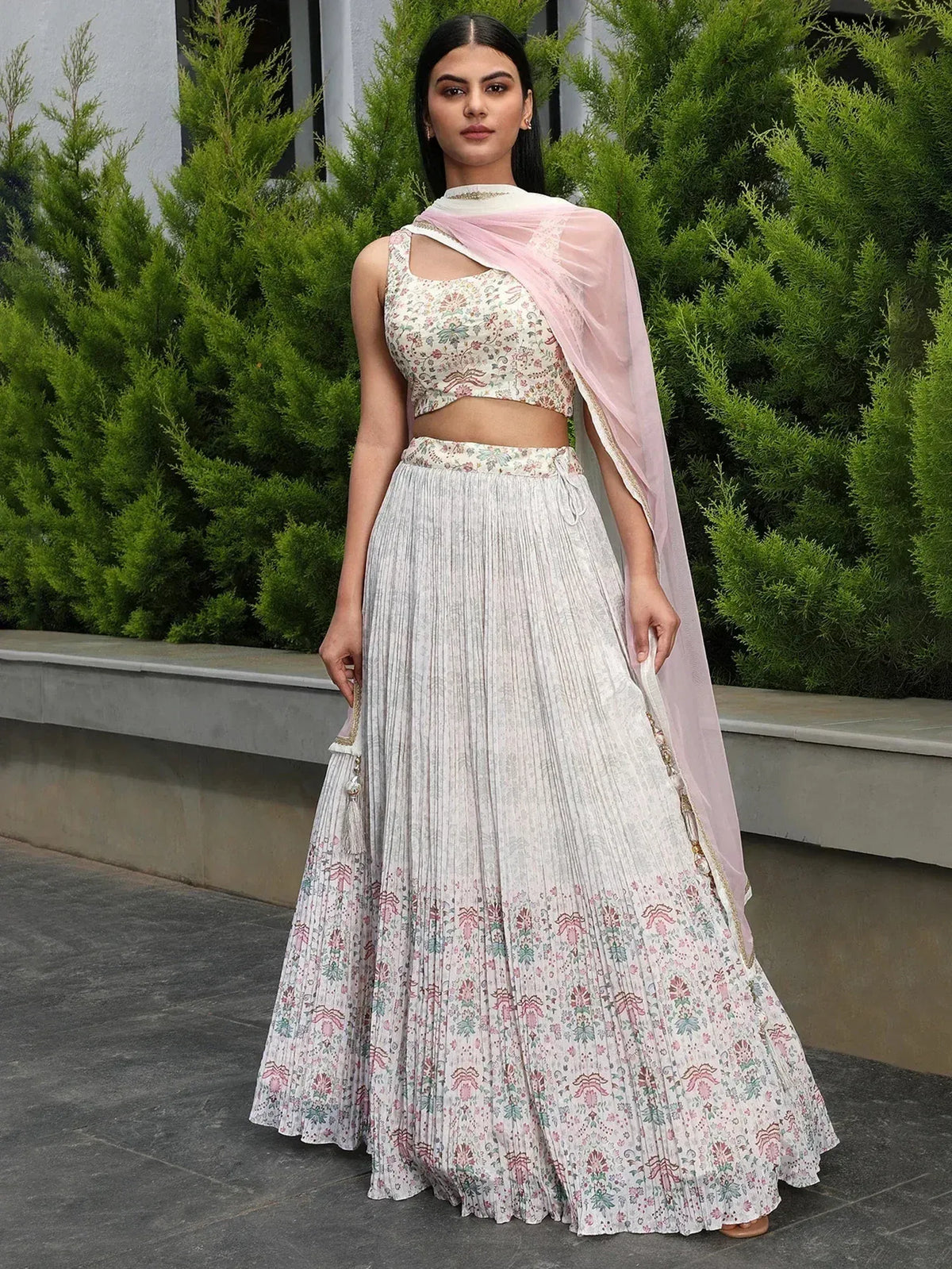 Floral printed lehenga choli with pleated skirt and pink dupatta, perfect for ethnic occasions