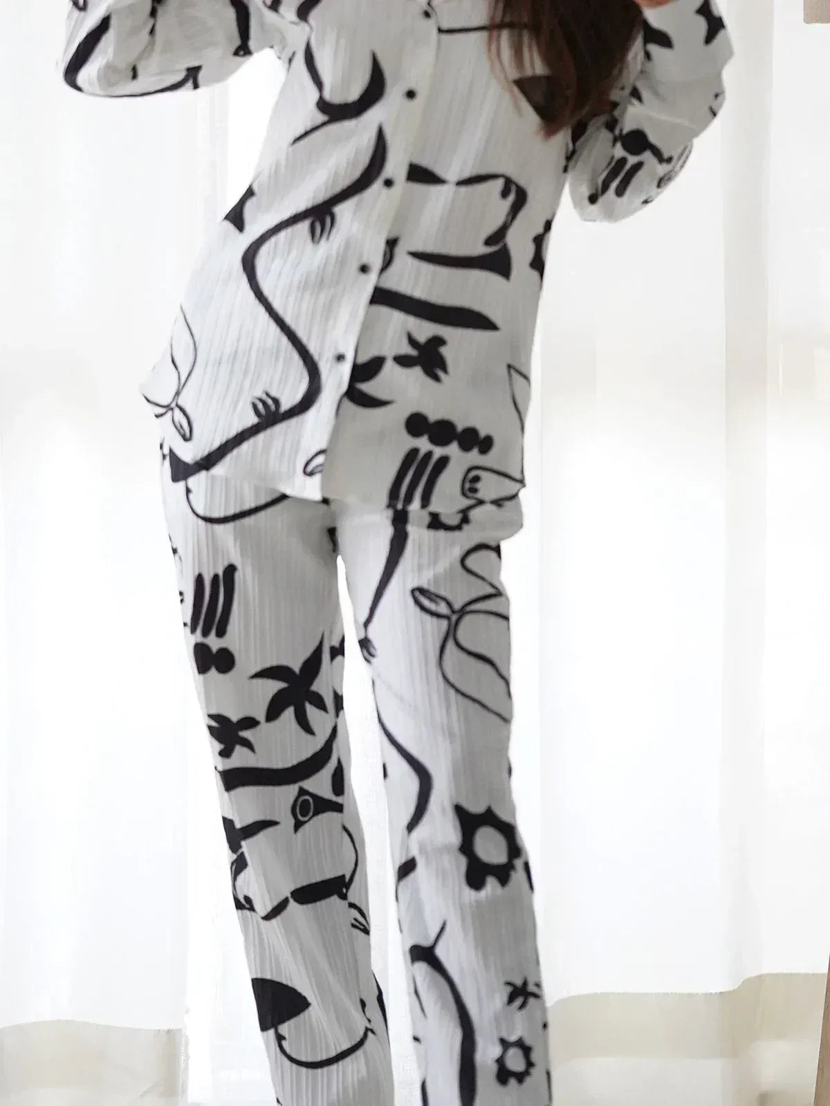 White and black printed ethnic palazzo set with abstract motifs, stylish comfort wear