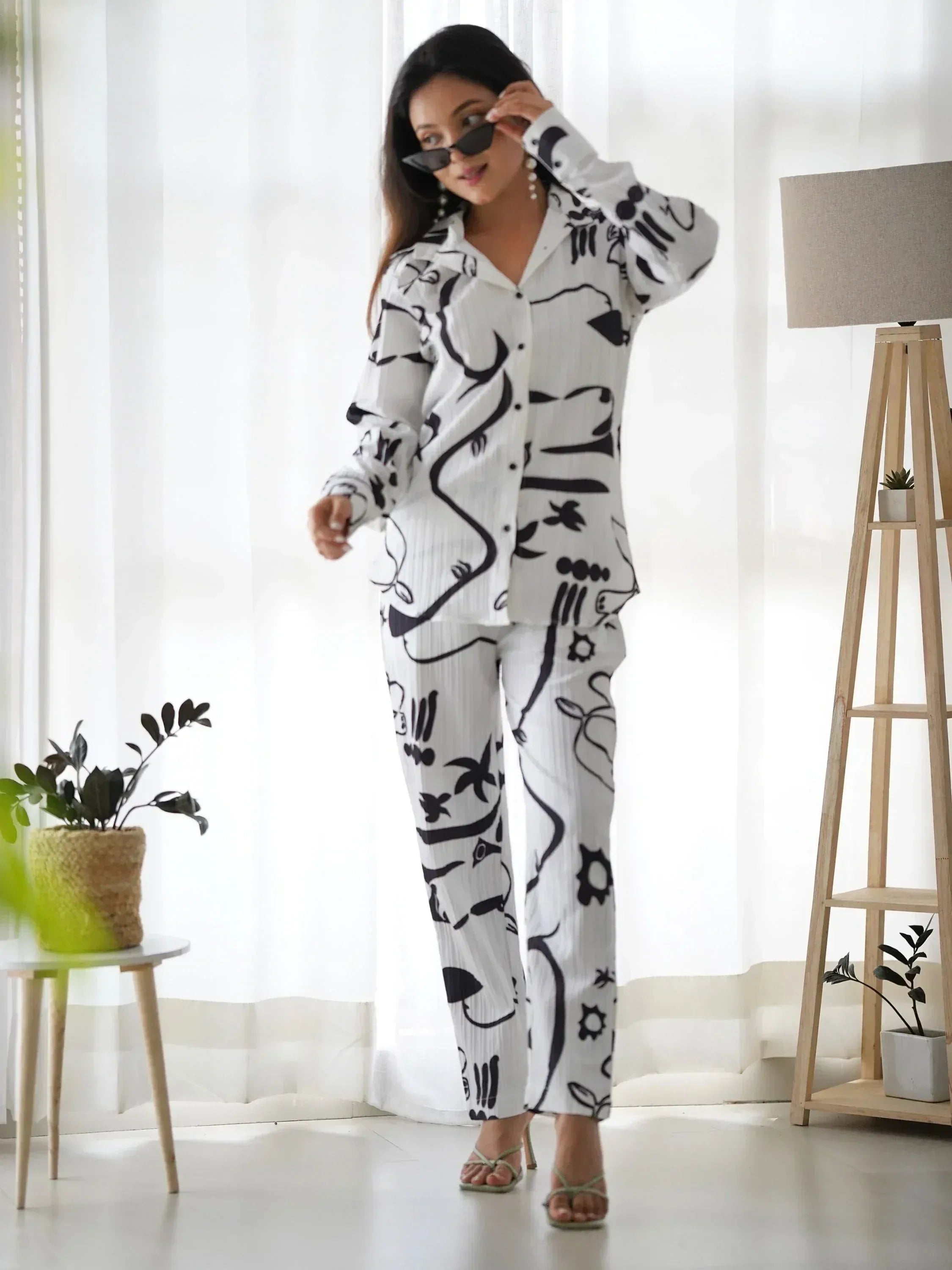 White and black printed pajama set with abstract patterns, stylish lounge wear for women