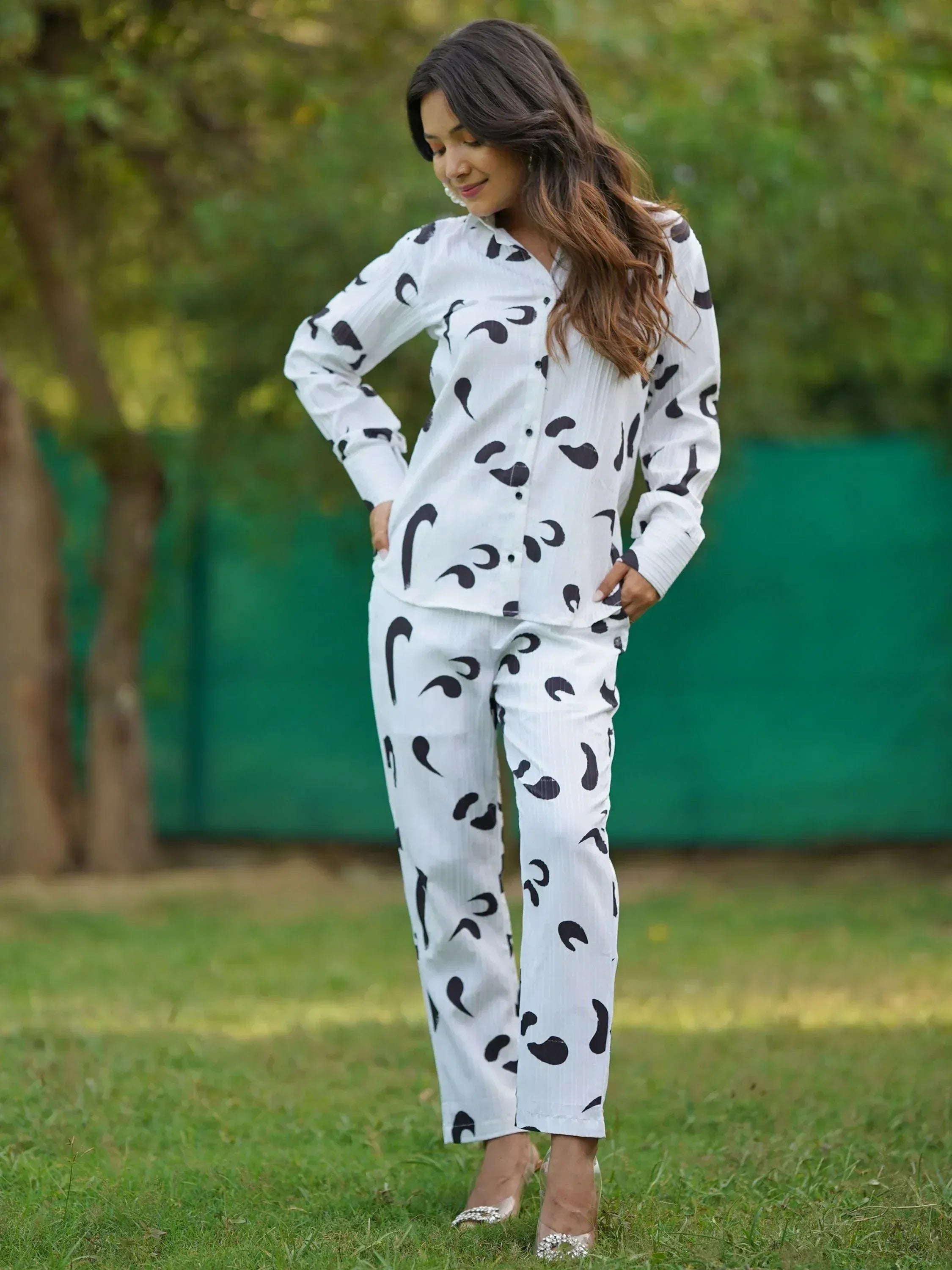 White printed kurta pants set with black abstract pattern, styled for casual ethnic wear outdoors