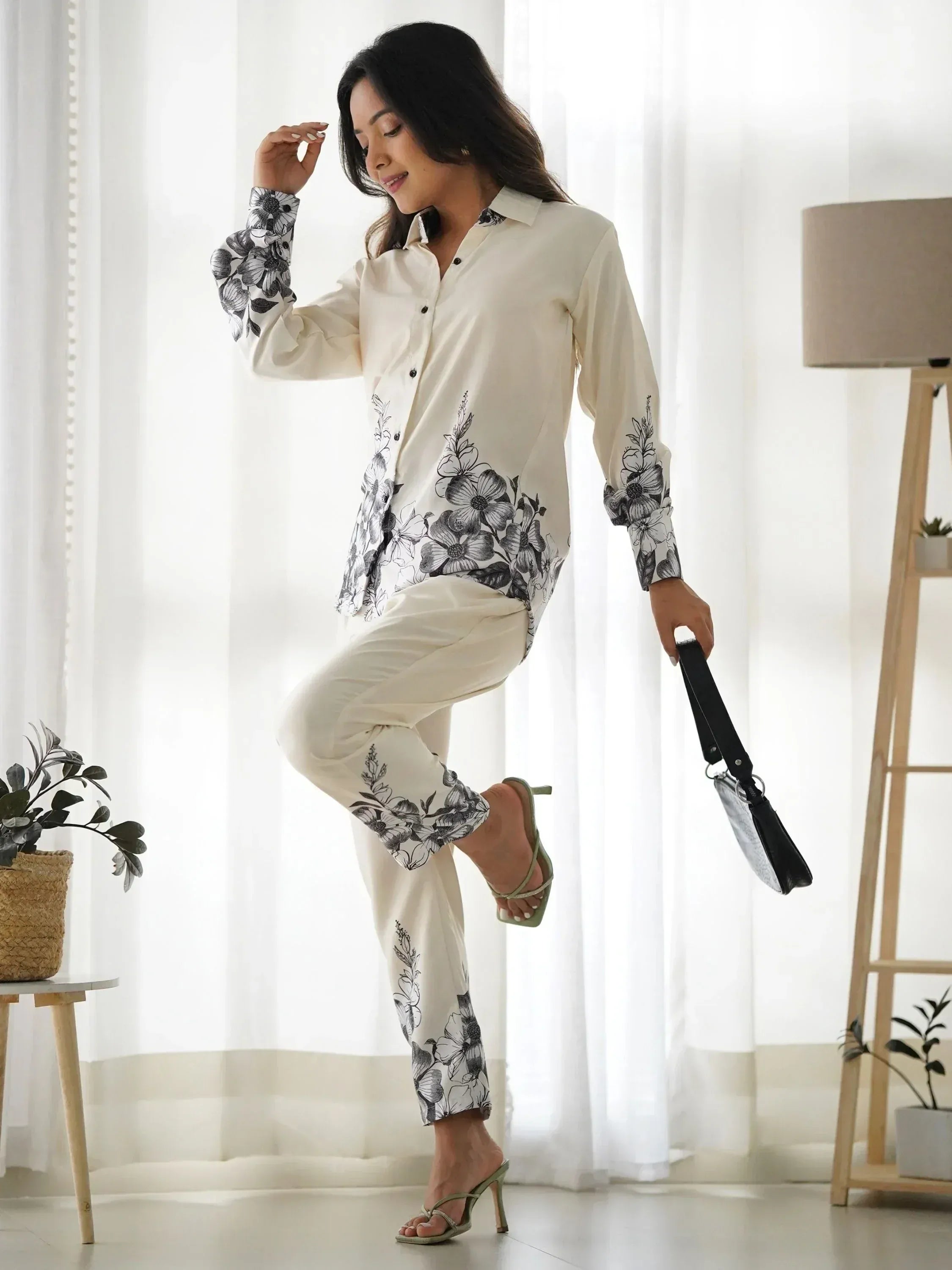 Elegant floral print shirt and pants set for women, perfect for casual or semi-formal occasions.