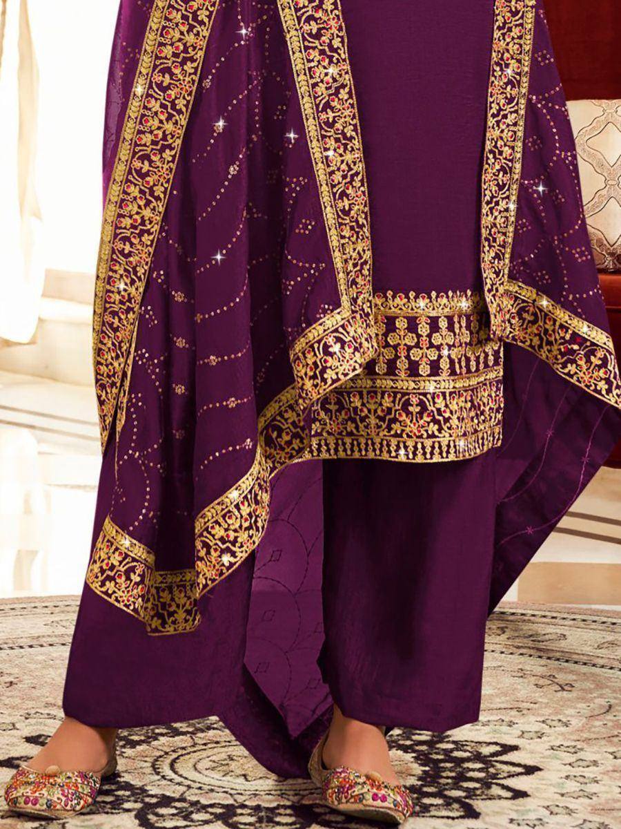 Purple ethnic salwar kameez with gold embroidery and mirror work, paired with embellished flats
