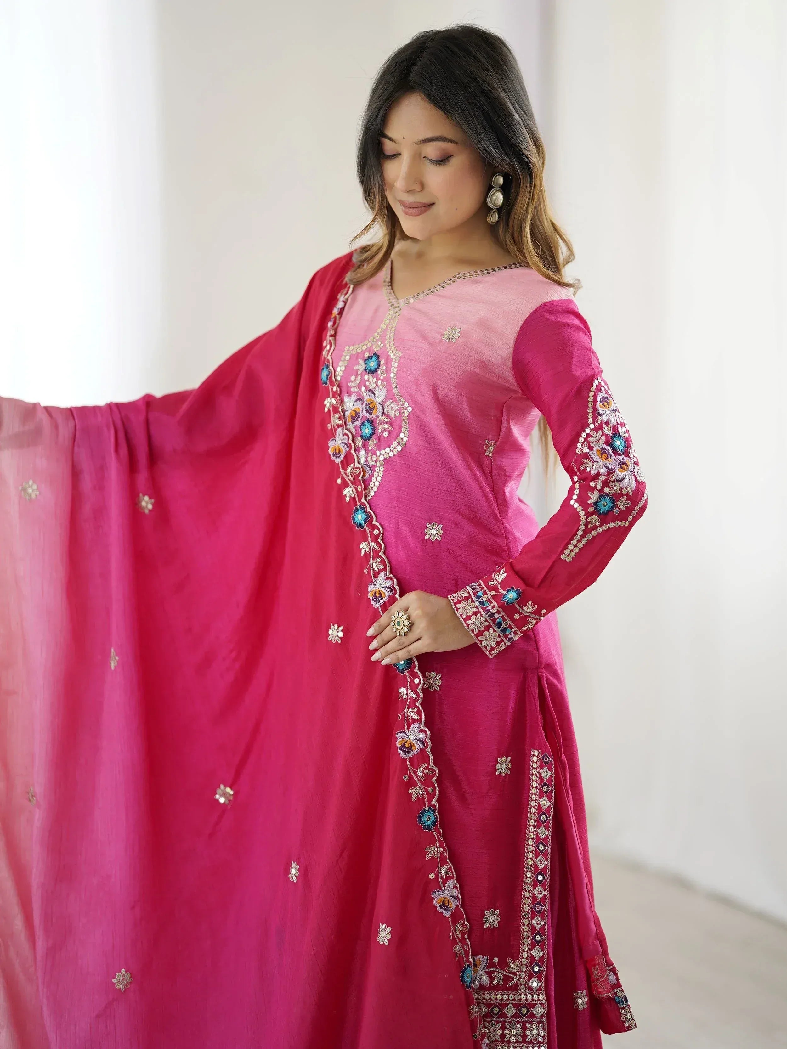Pink embroidered Indian salwar kameez with floral detailing and matching dupatta