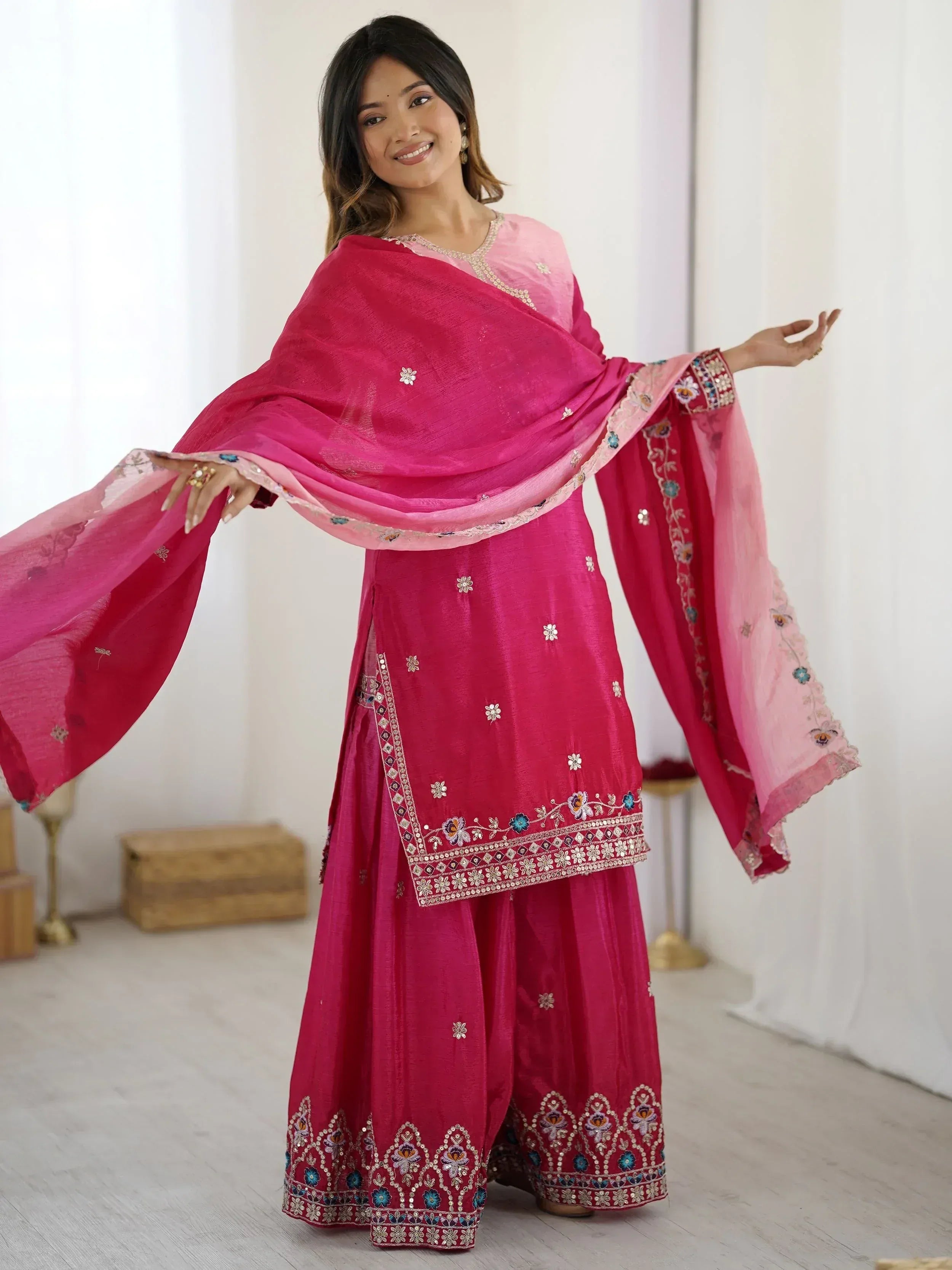 Pink embroidered salwar kameez with floral detailing and matching dupatta, ideal for Indian ethnic occasions