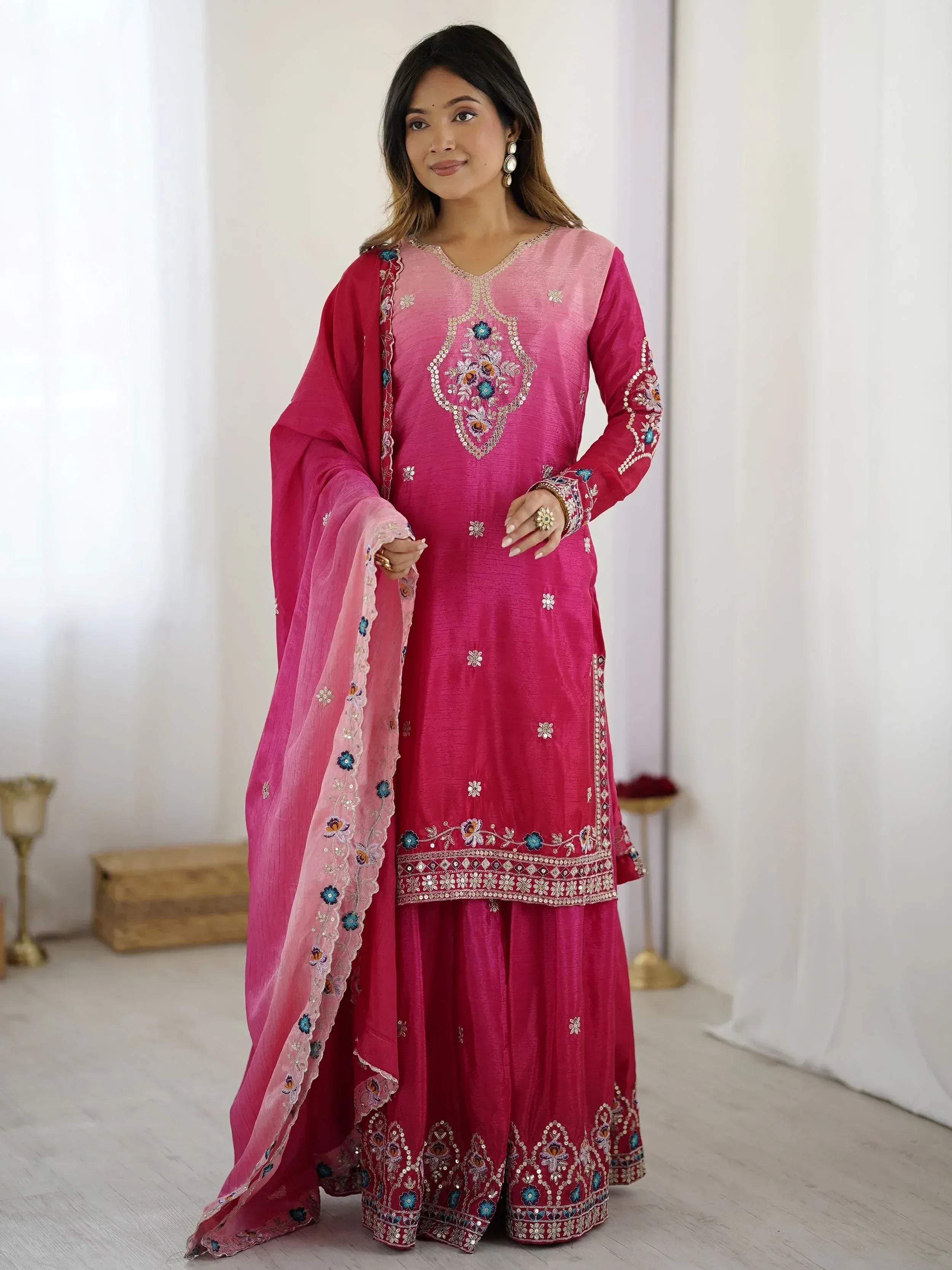 Pink embroidered salwar kameez with floral detailing and matching dupatta, ideal for Indian ethnic wear