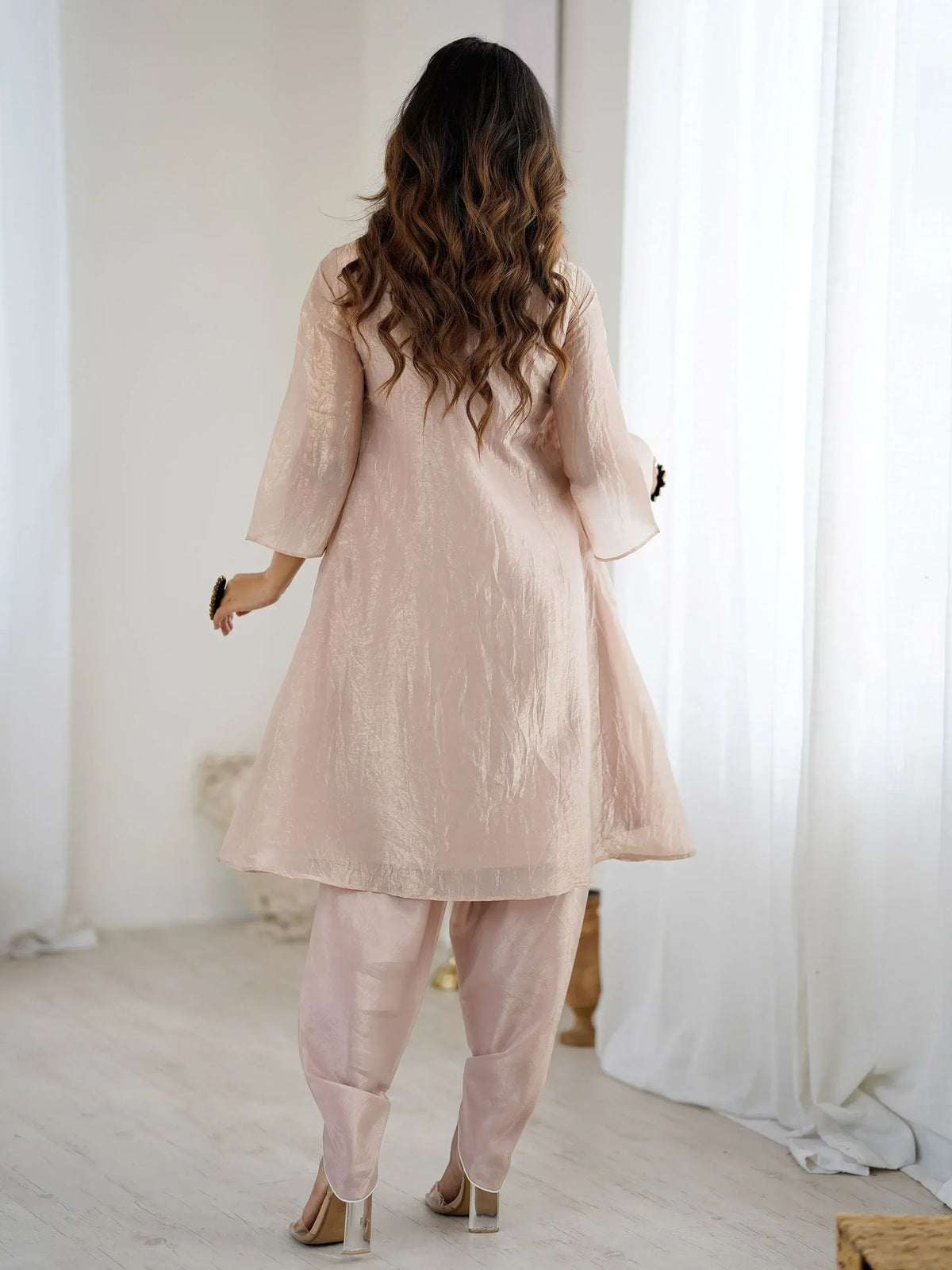 Elegant pink ethnic kurta set with flared sleeves and matching pants for women