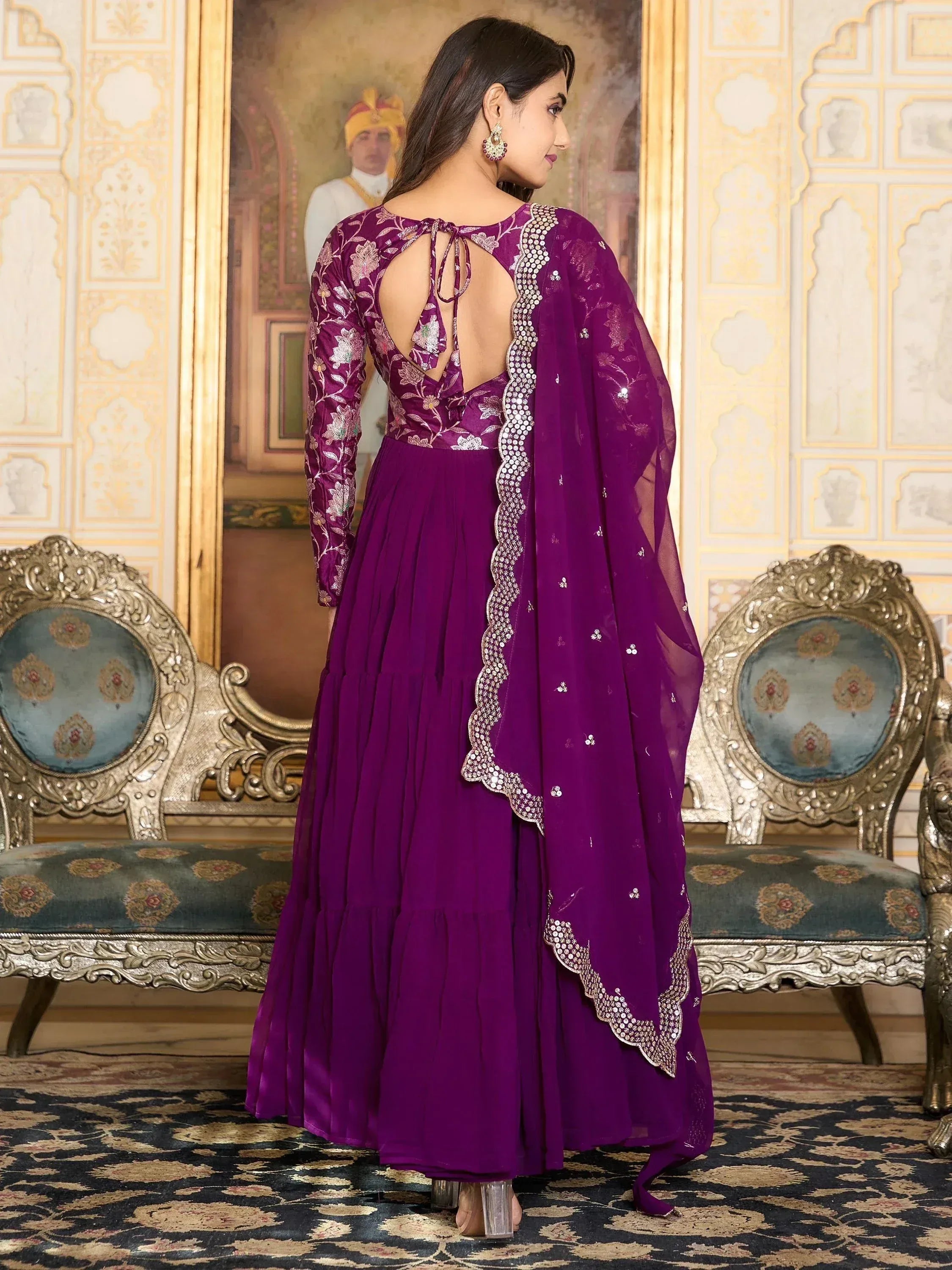 Purple embroidered ethnic gown with back tie and embellished dupatta for festive occasions