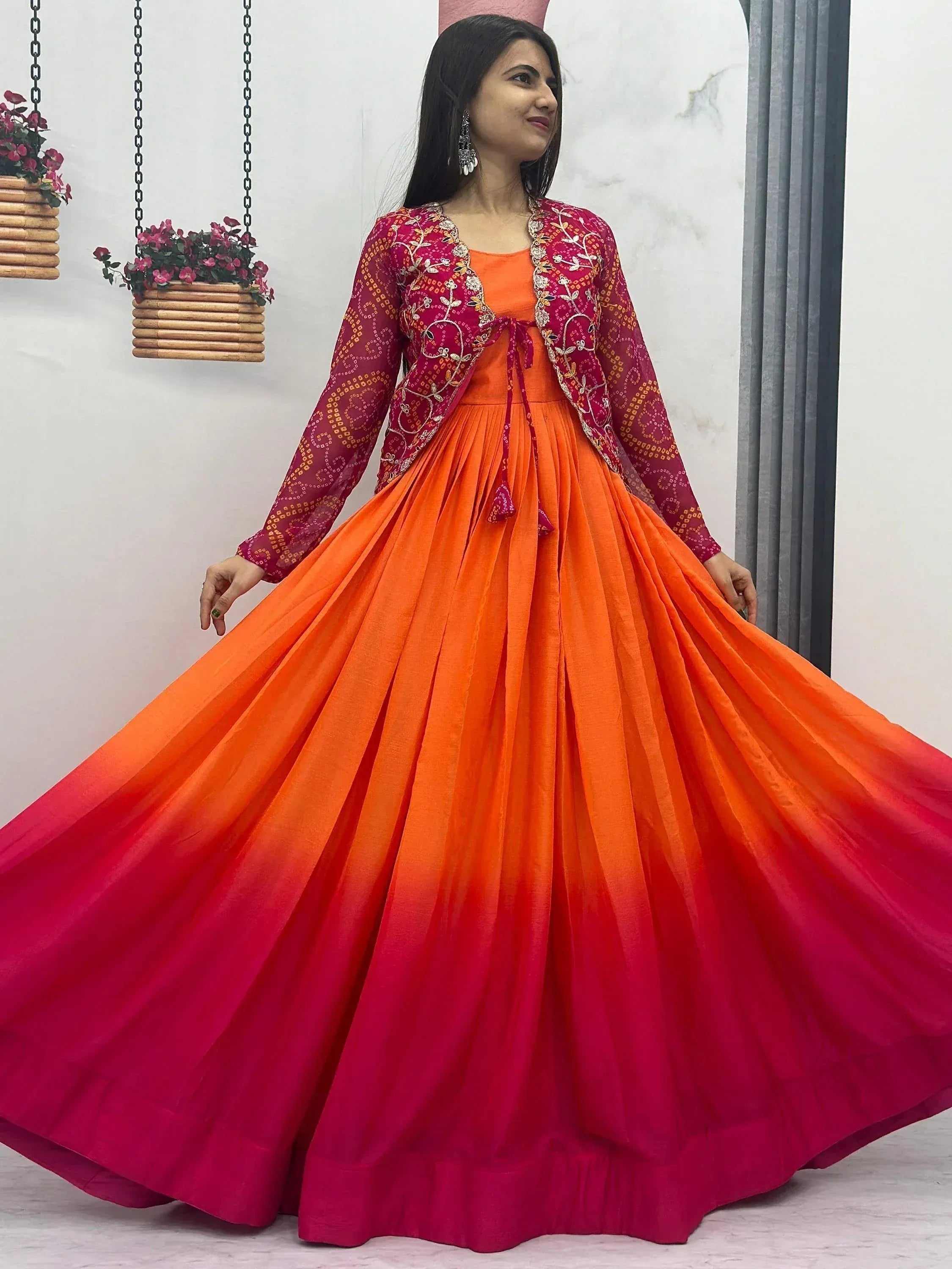 Vibrant orange to pink ombre ethnic gown with embroidered jacket for festive occasions