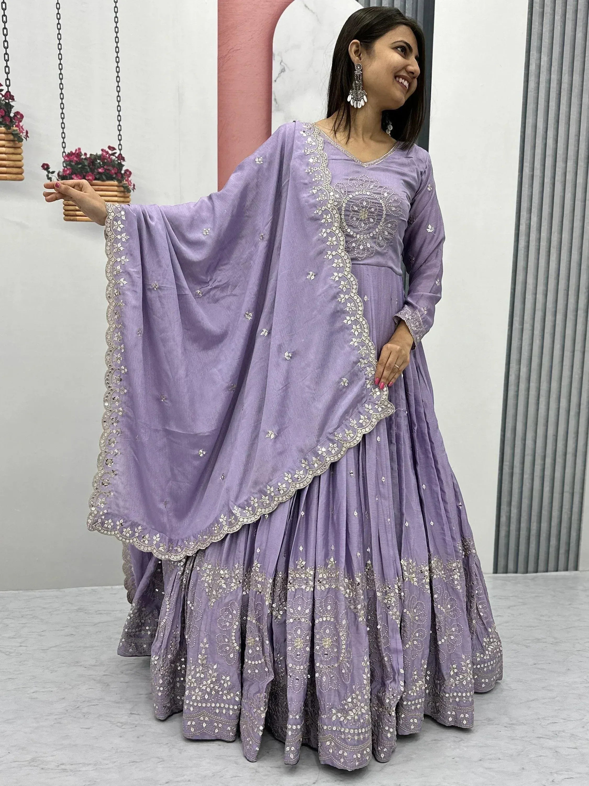 Lavender ethnic gown with intricate embroidery and embellishments, perfect for festive occasions