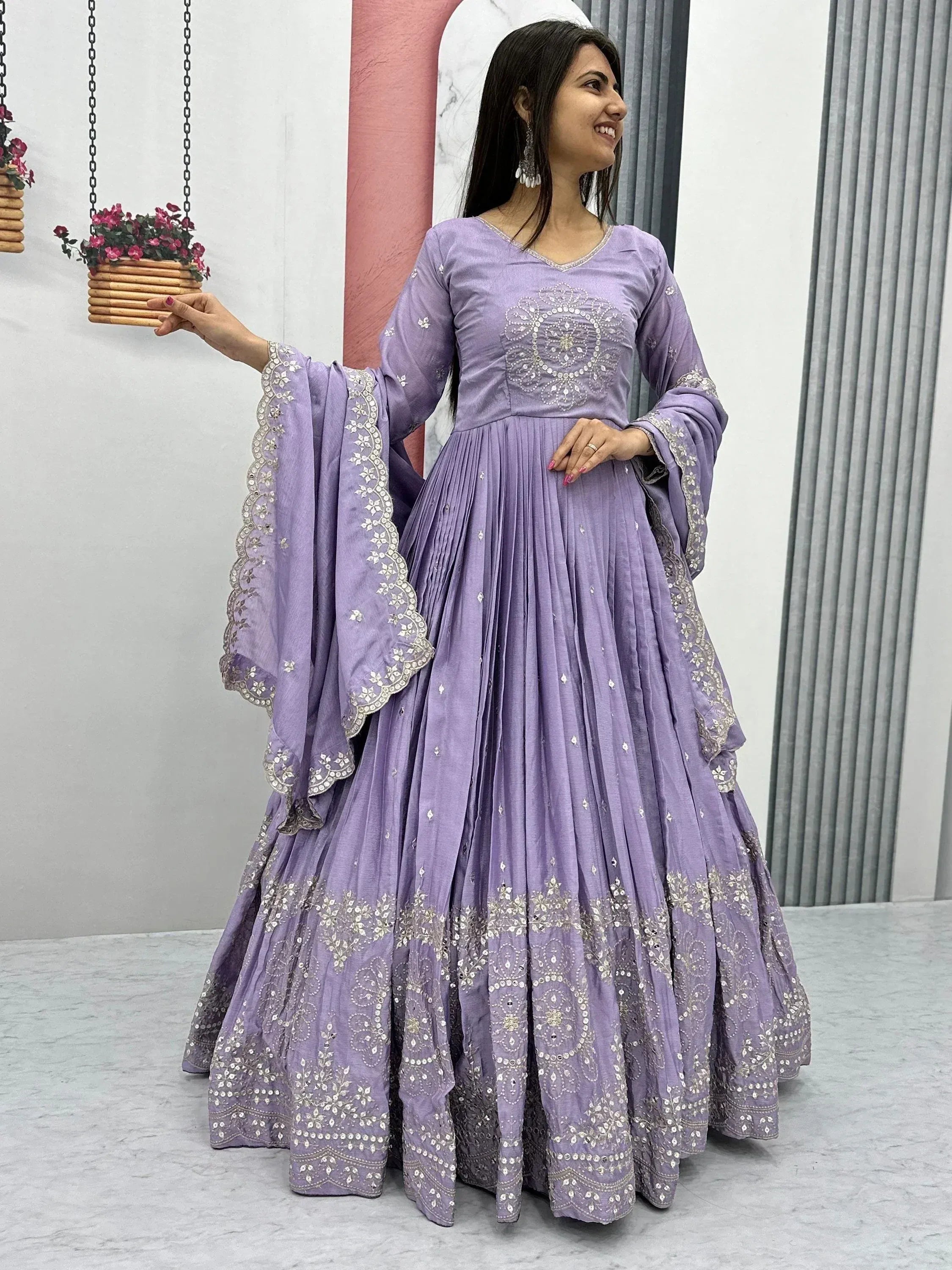 Lavender ethnic anarkali gown with silver embroidery, flared skirt, and bell sleeves for Indian occasions